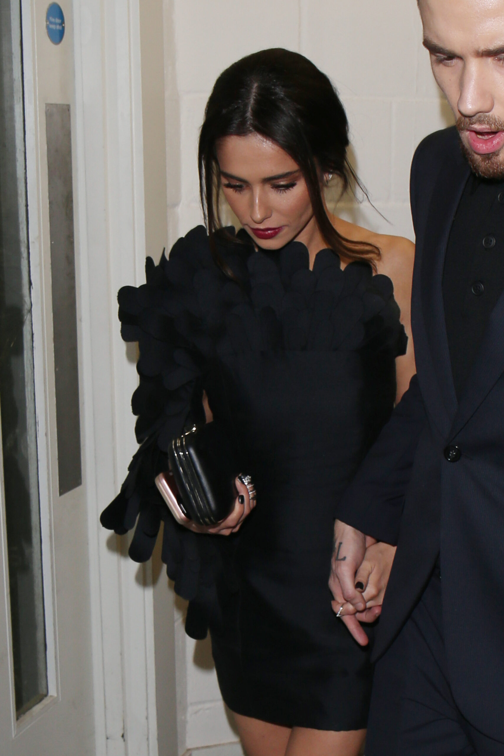 Cheryl Tweedy holding Liam Payne's hand