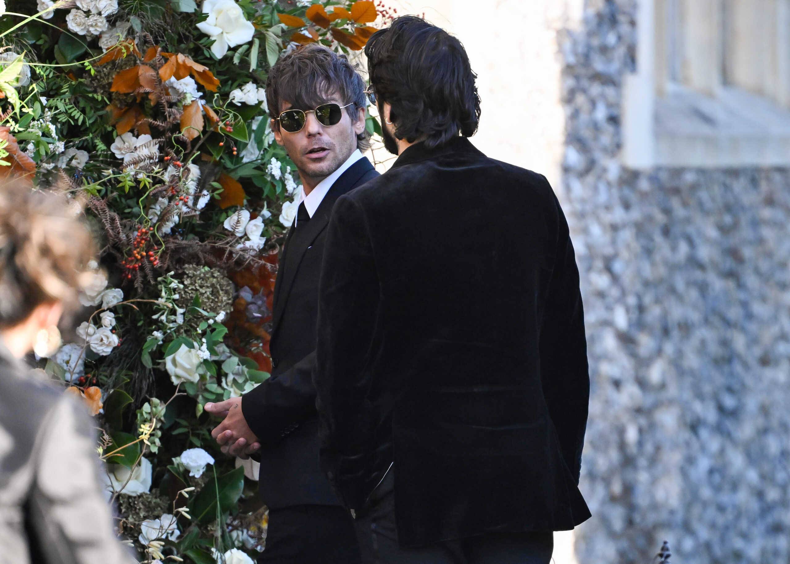 Louis Tomlinson and Zayn Malik outside church