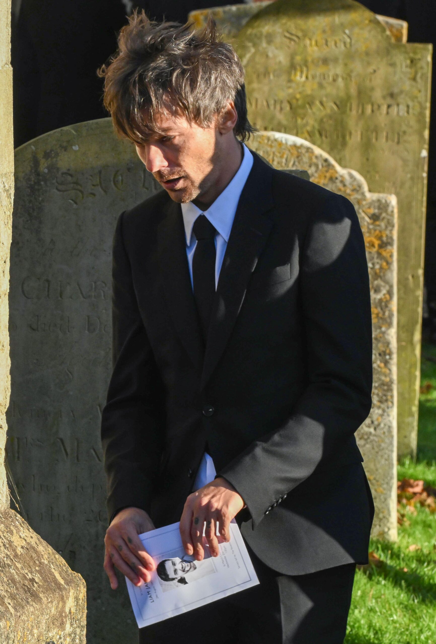 Louis Tomlinson looking sad at Liam Payne's funeral