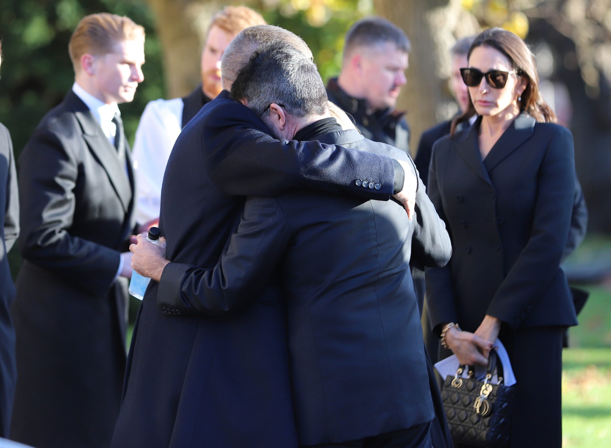 Simon Cowell hugging Liam Payne's dad Geoff at funeral