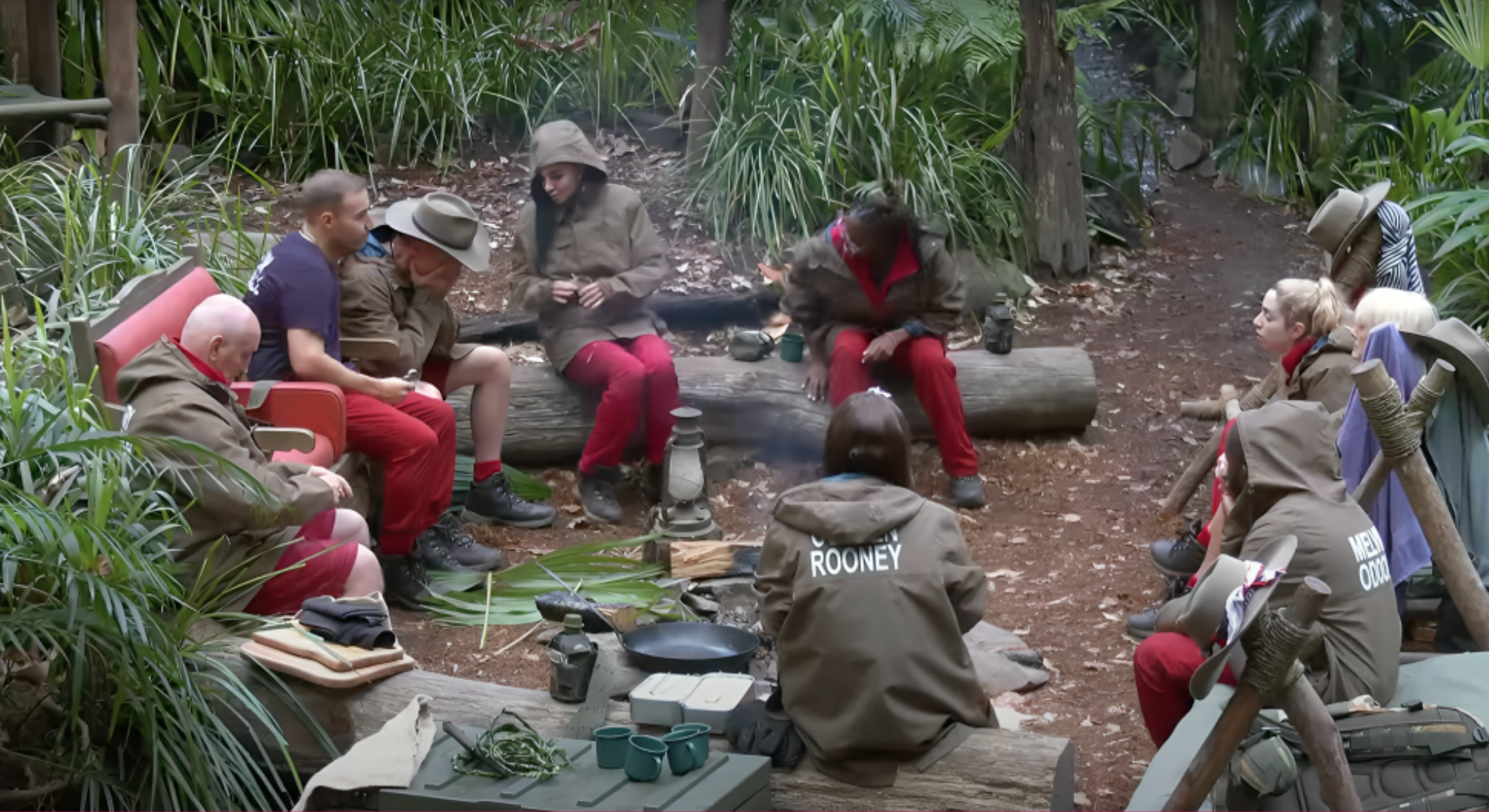 I'm A Celebrity 2024 cast sit around the fire pit, some of them comfort Danny Jones as he breaks down