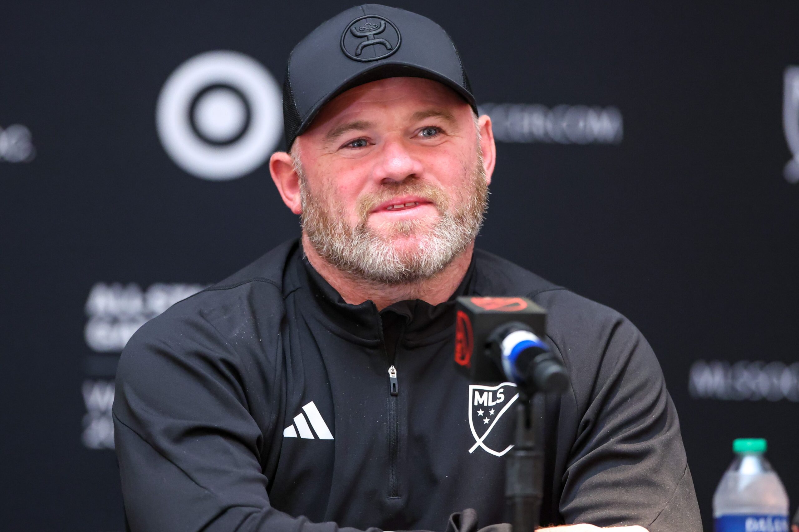 Wayne Rooney smiling during football event