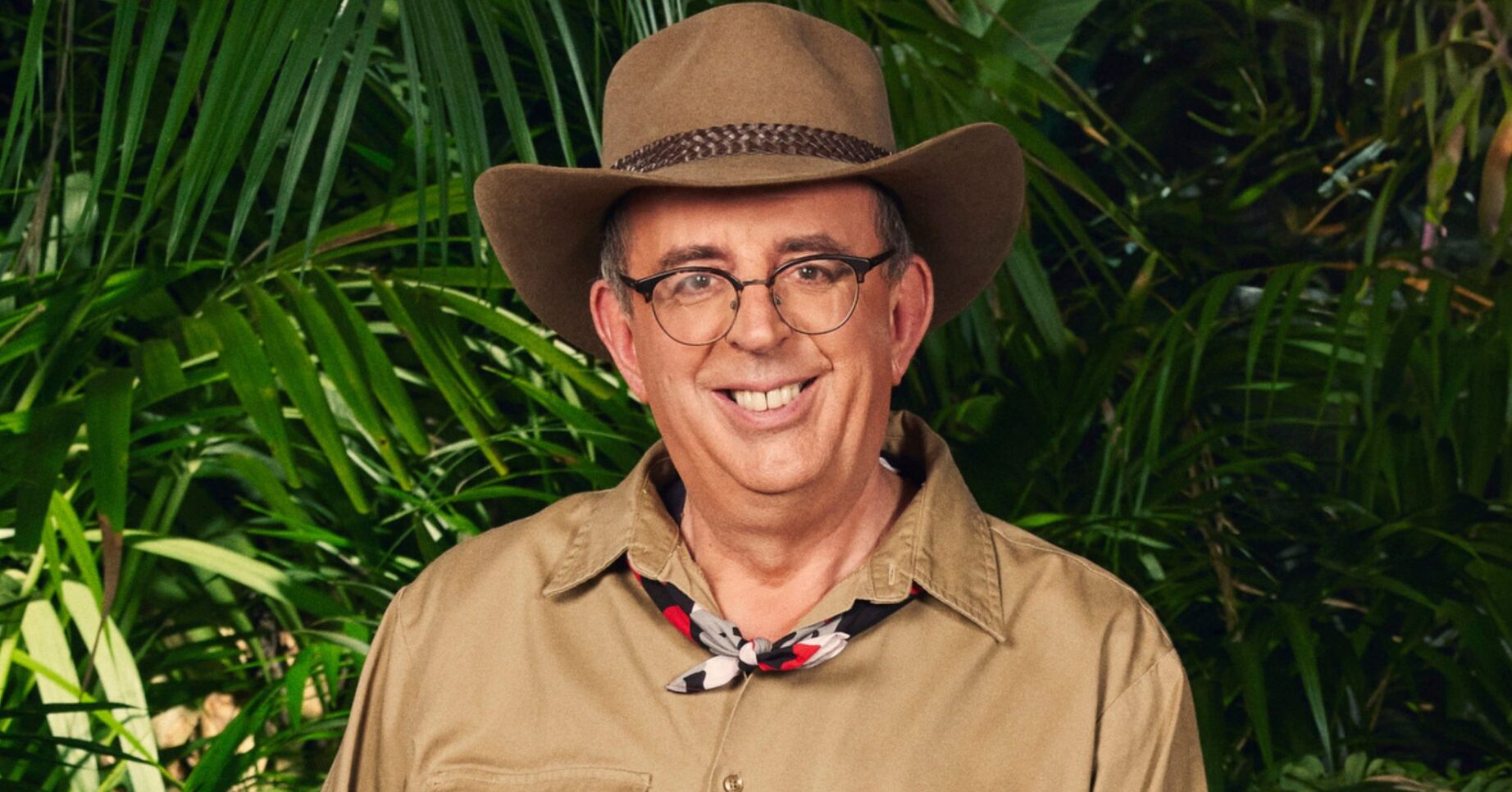 Richard Coles smiling in official I'm A Celebrity pic