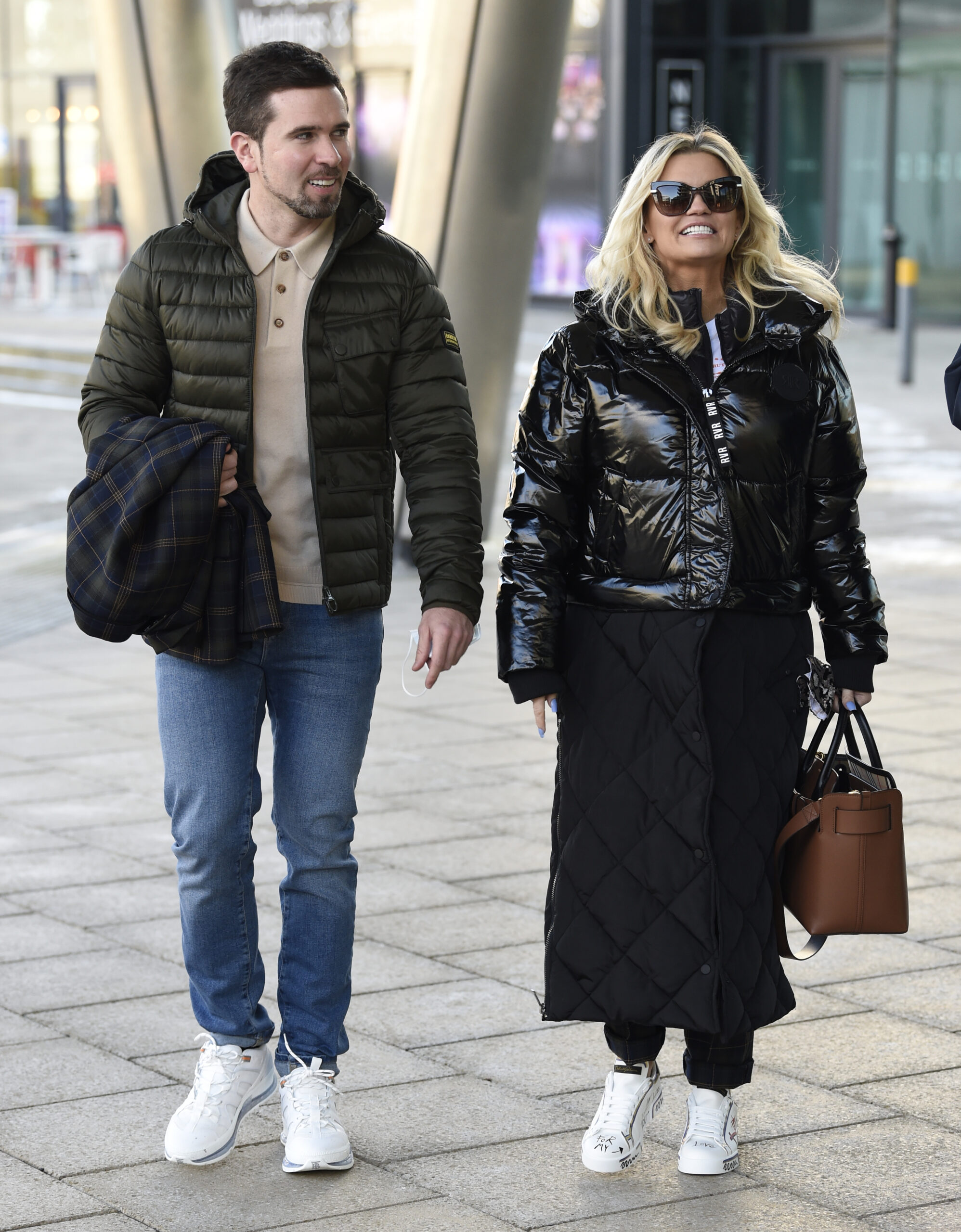 Kerry Katona and Ryan Mahoney walking and smiling