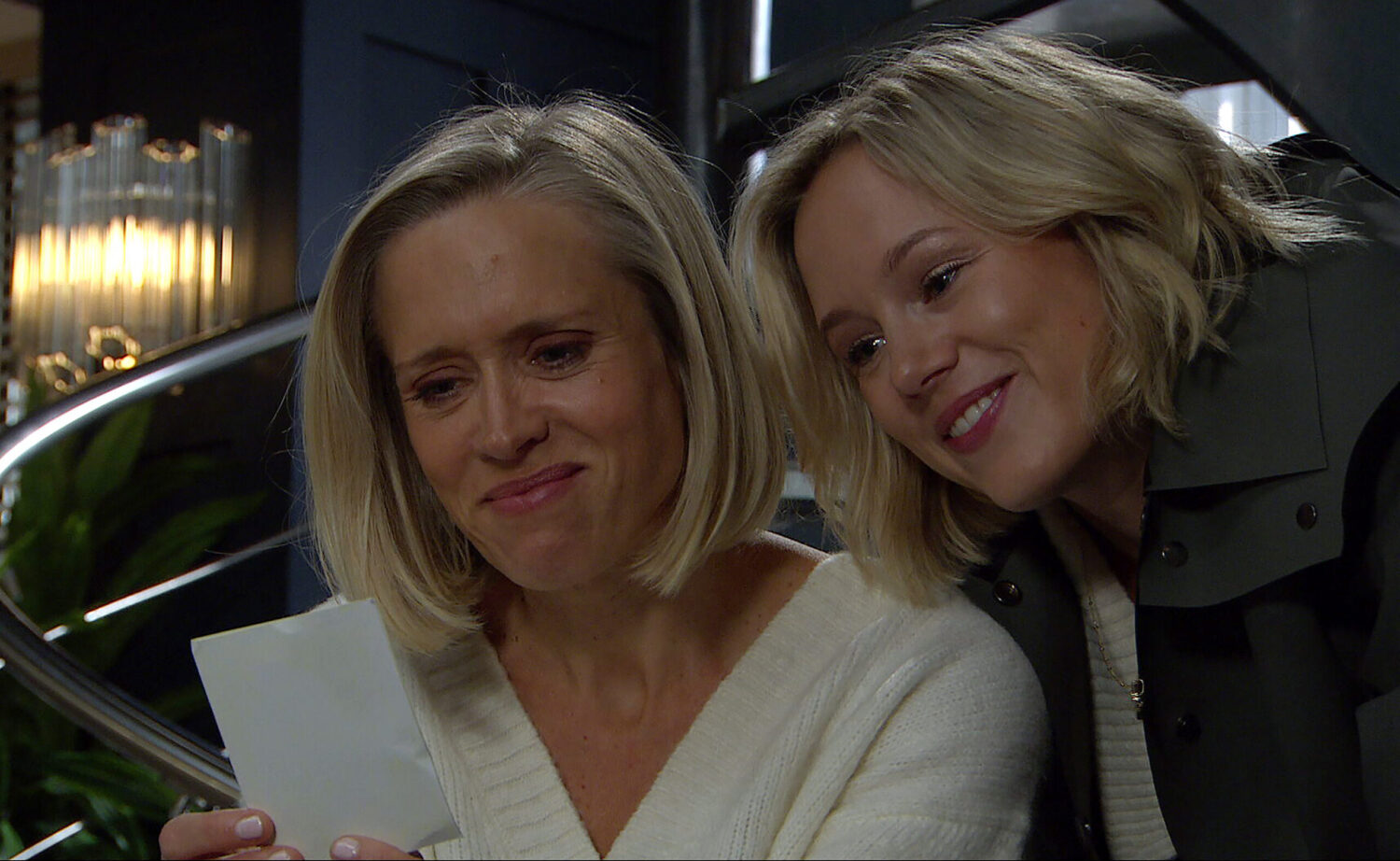 Steph and Ruby are smiling at a photo