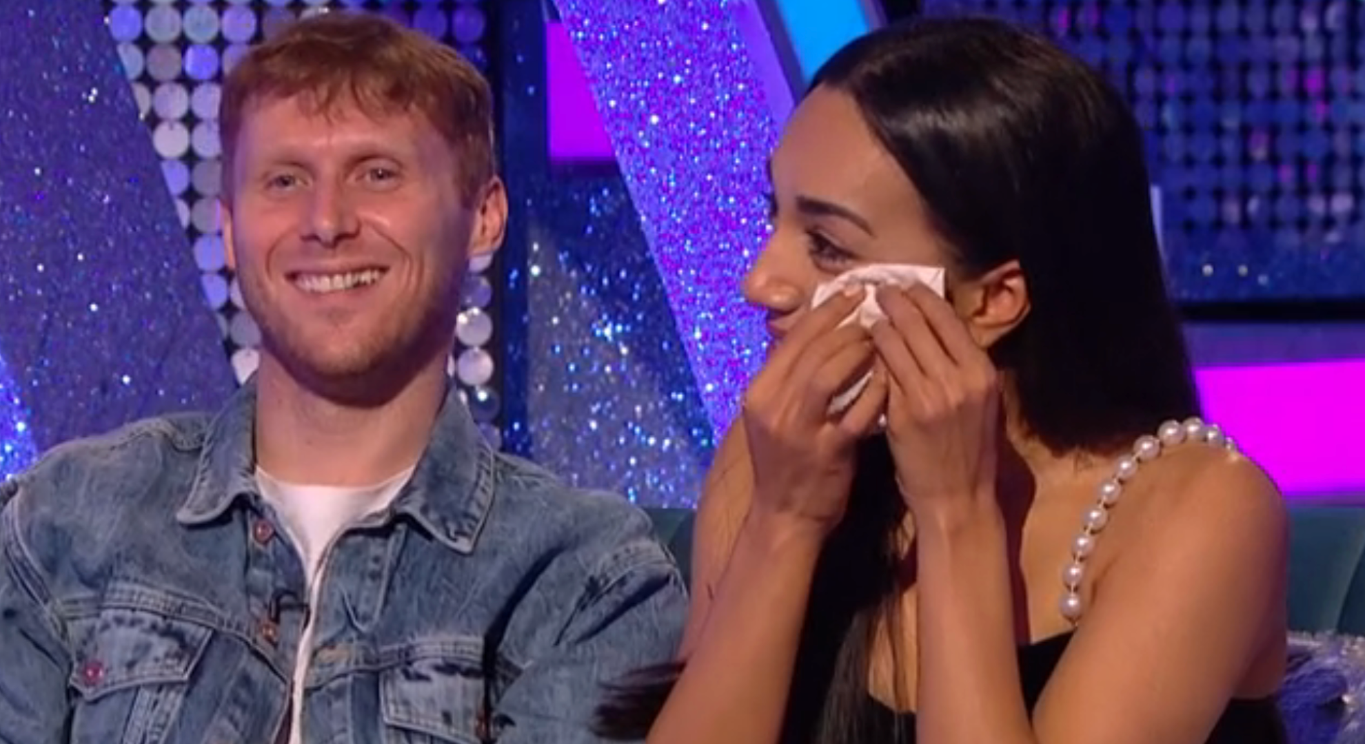 Jamie Borthwick smiling beside Michelle Tsiakkas crying