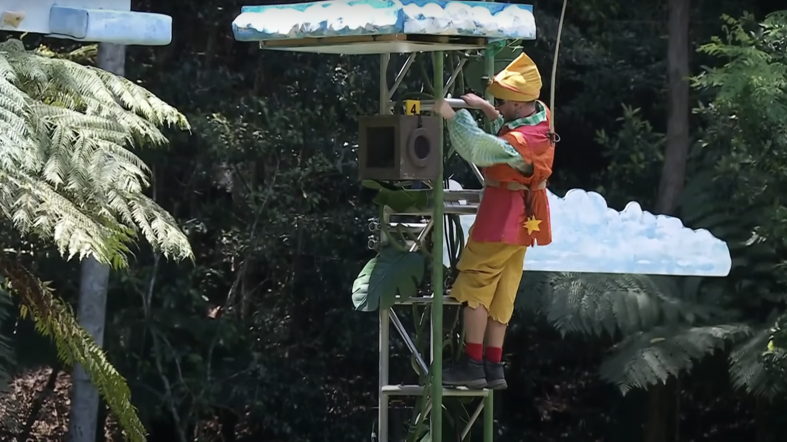 Dean McCullough in a clown costume taking part in a Trial on I'm A Celebrity