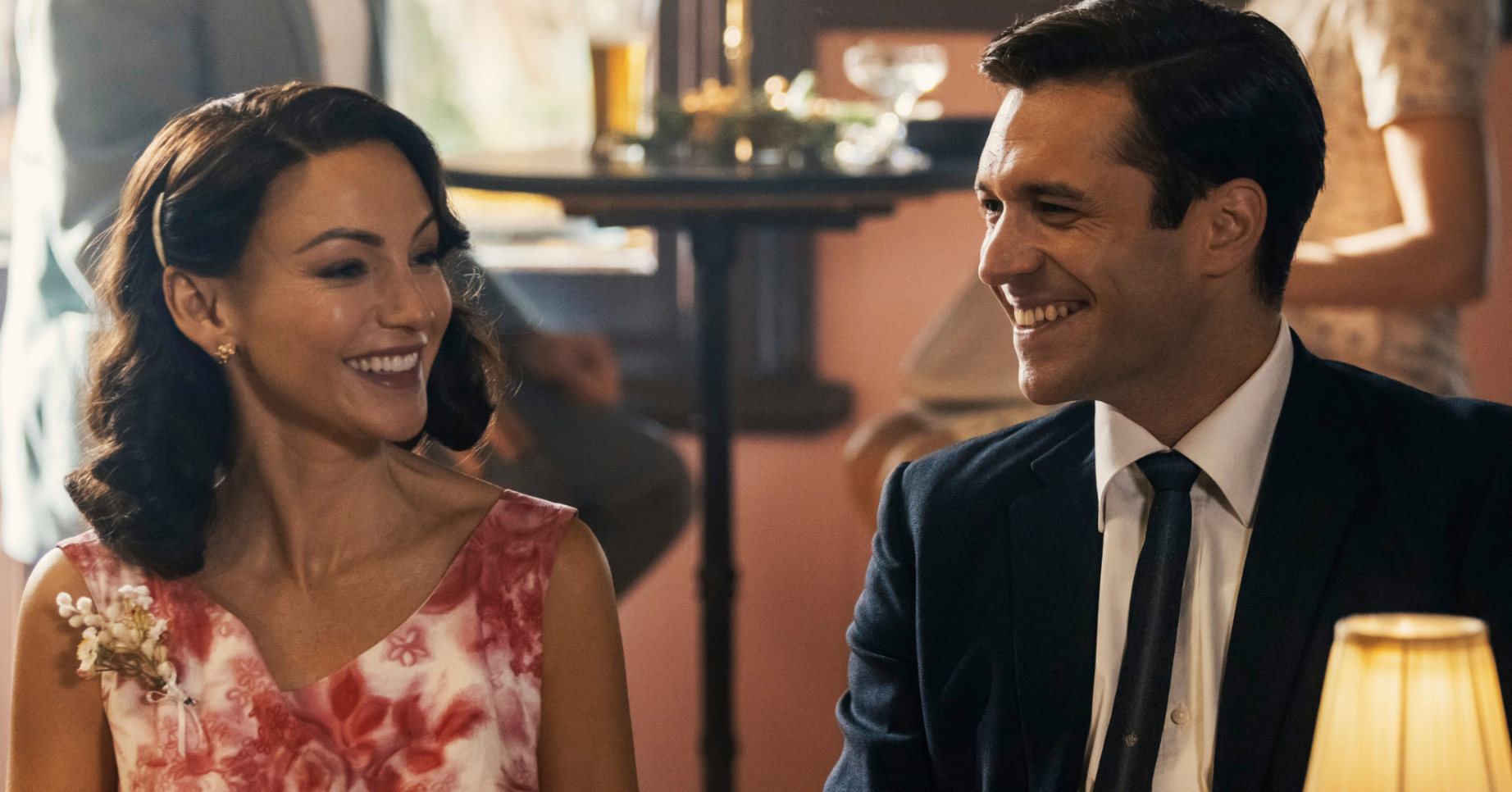 Michelle Keegan's character smiling in Ten Pound Poms series two