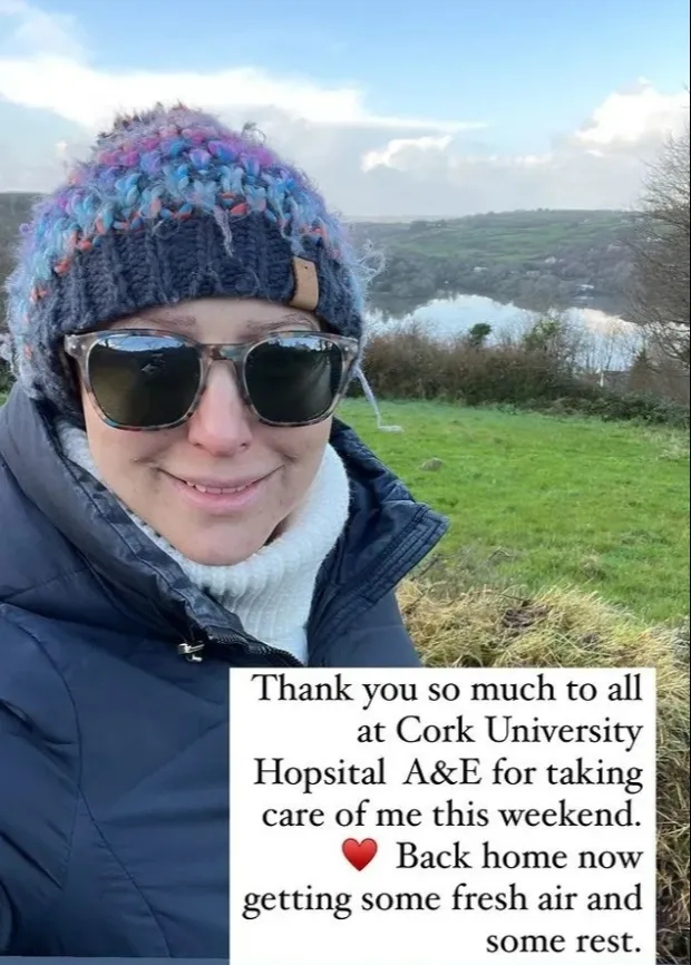 Ali Bastian wearing sunglasses and a hat