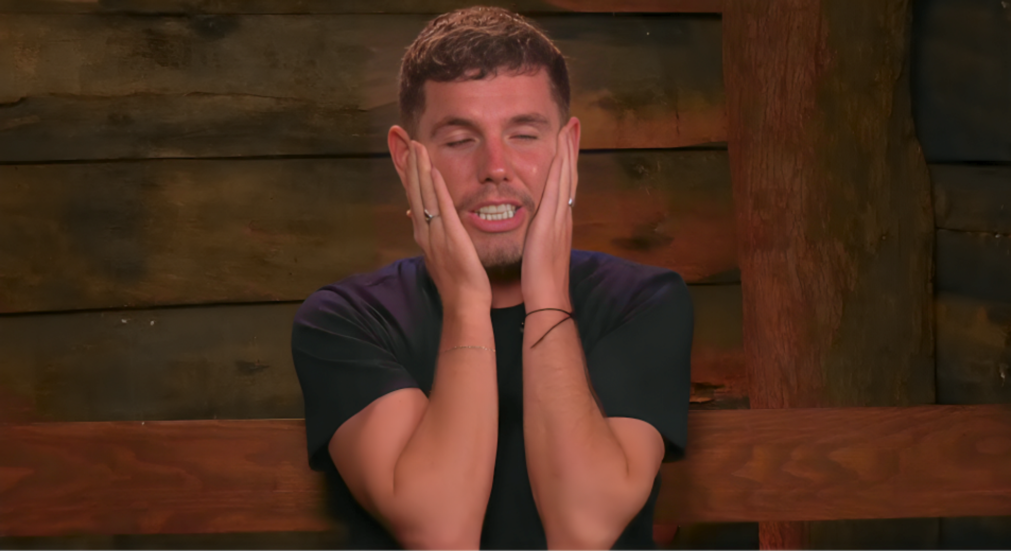 Dean McCullough puts both hands to his face in shock that he got to sing with Danny Jones on I'm A Celebrity