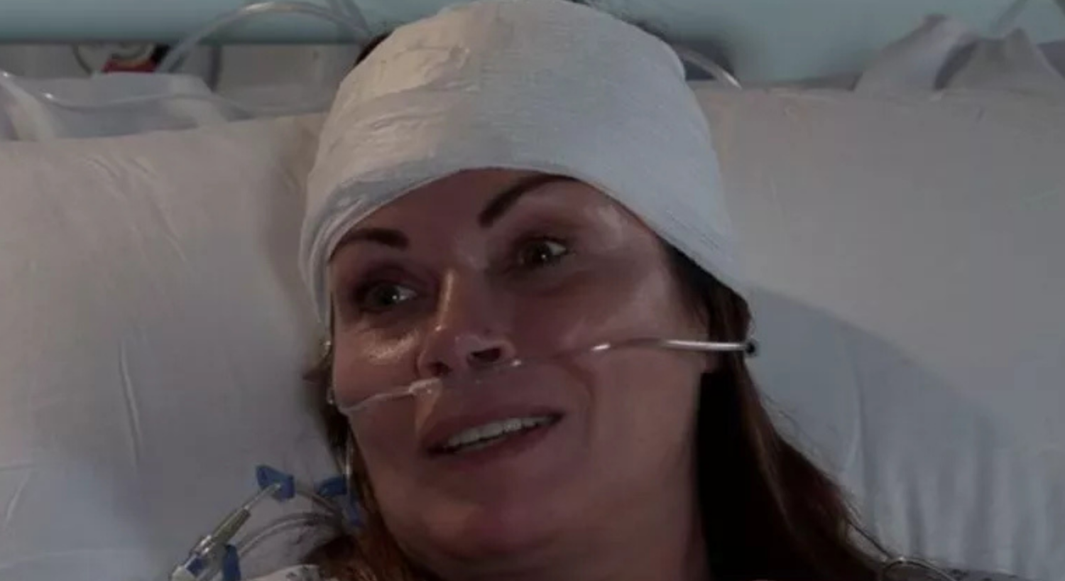 Carla Connor in Coronation Street in her hospital bed with head bandage