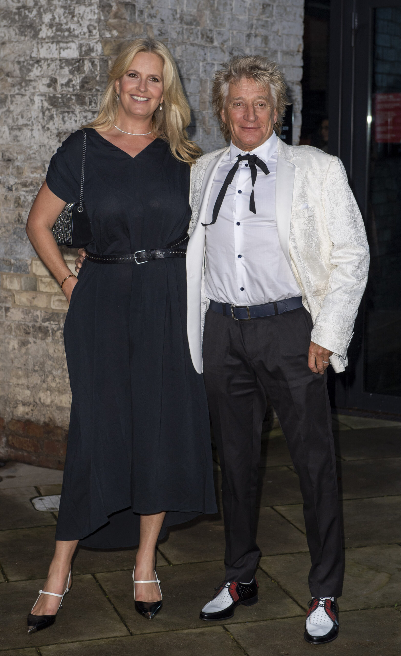 Penny Lancaster and Rod Stewart smiling
