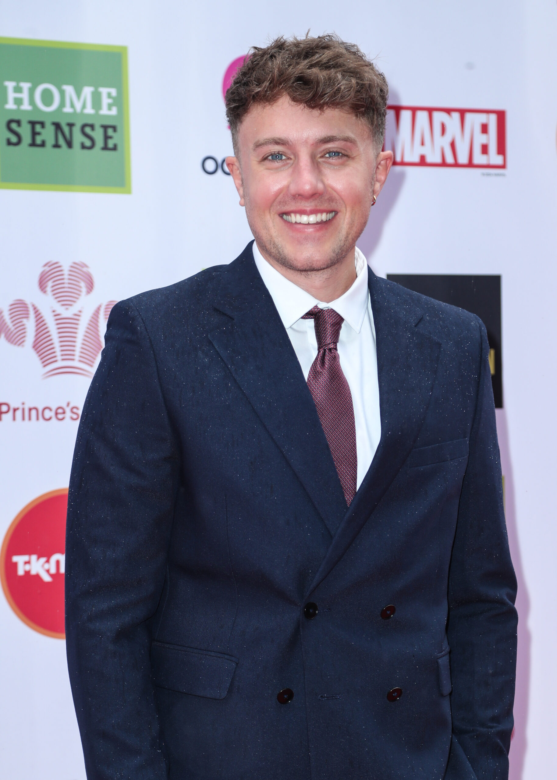 Roman Kemp on the red carpet in a suit