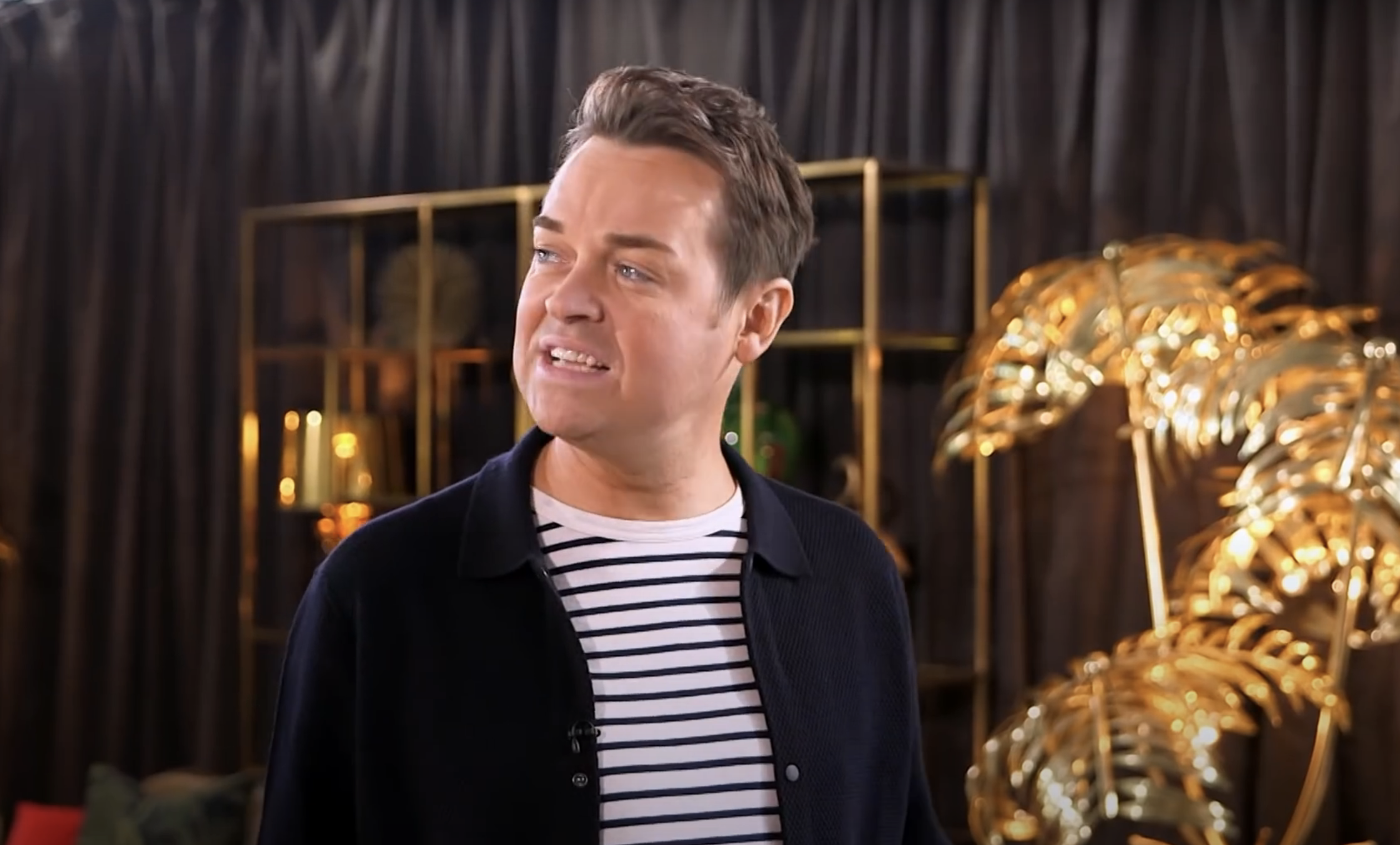 Stephen Mulhern looking sideways at David Walliams on the Britain's Got Talent set