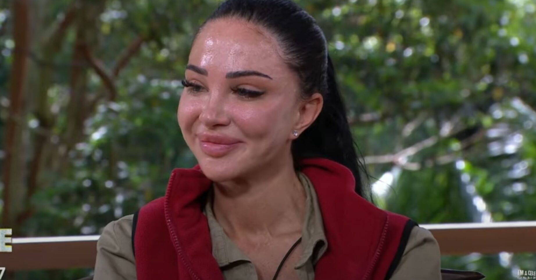 Tulisa smiles while talking to Ant & Sec after elimination