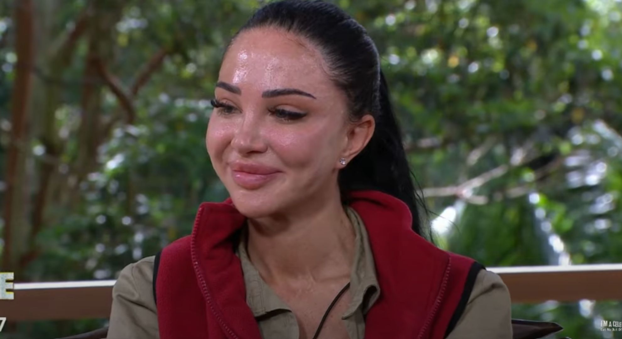 Tulisa smiles while talking to Ant & Sec after elimination