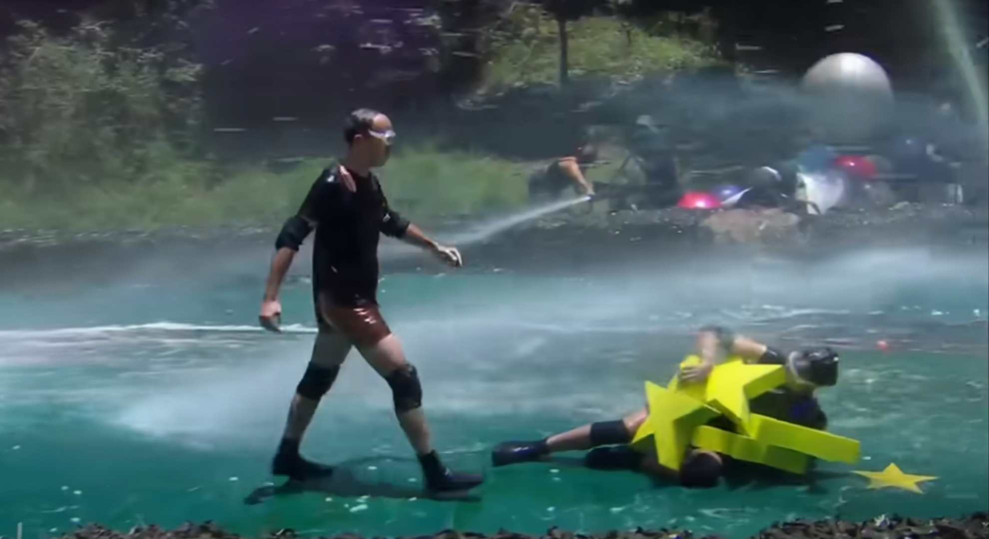 Matt Hancock walks steadily during Cyclone while Jill Scott struggles to stand up holding the stars 