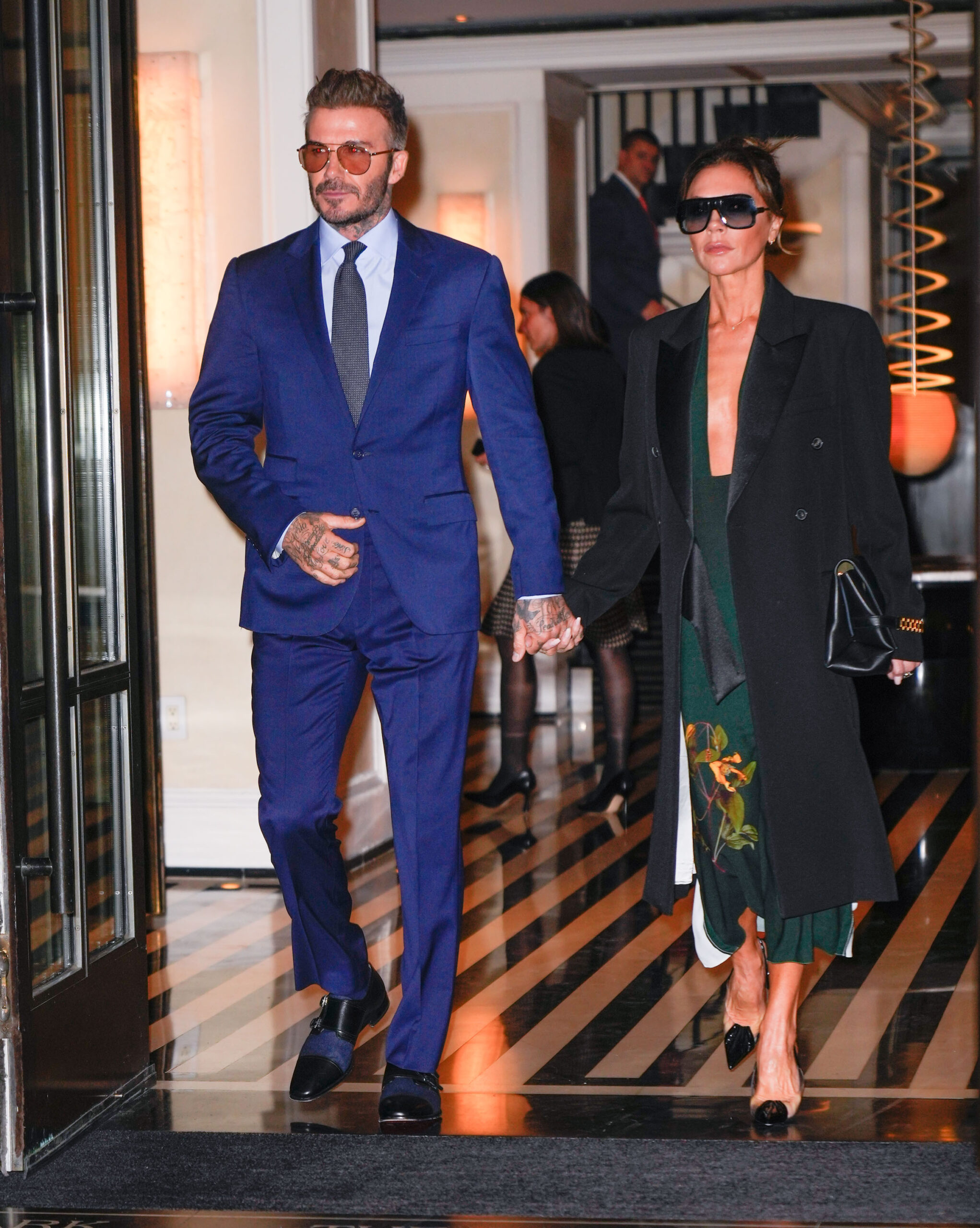 David and Victoria Beckham walk hand in hand during their trip to the US