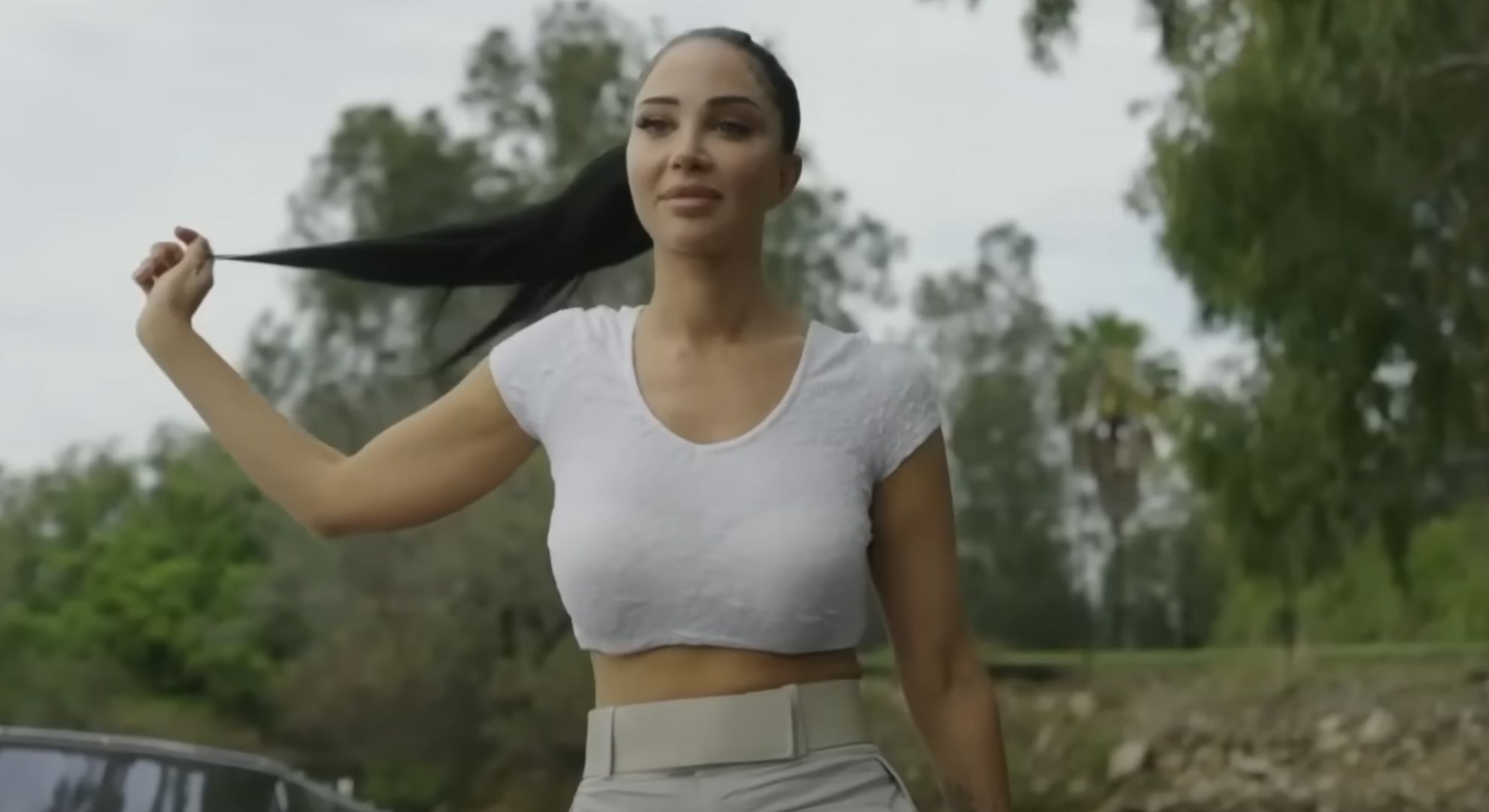 Tulisa touching her hair whilst walking on I'm A Celeb