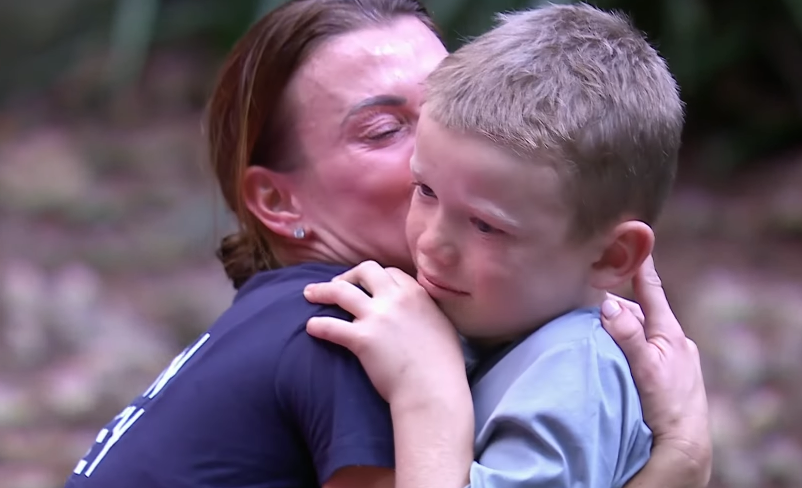 Coleen Rooney kissing her little boy