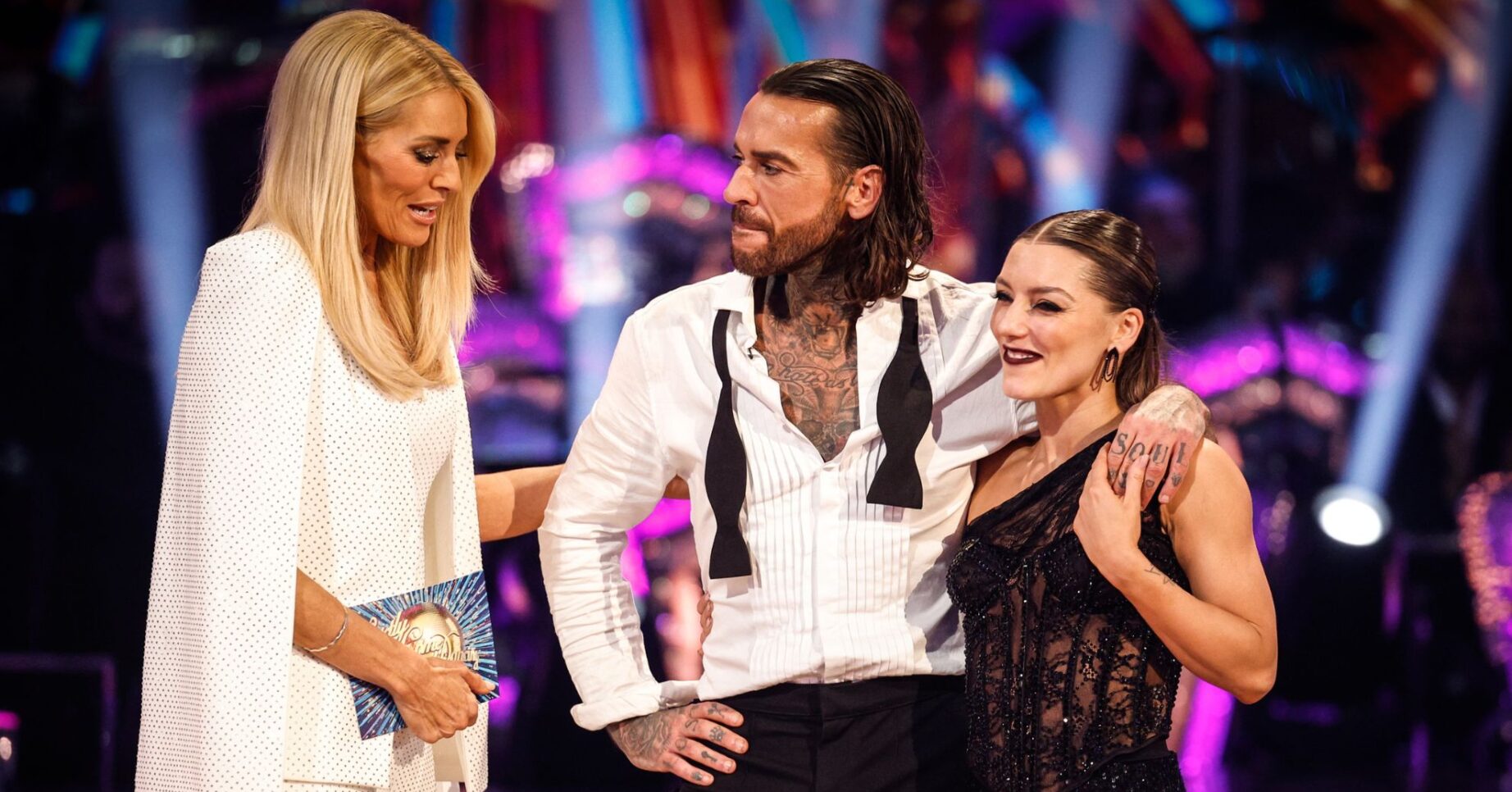 Tess Daly talking to Pete Wicks and Jowita as they exit Strictly