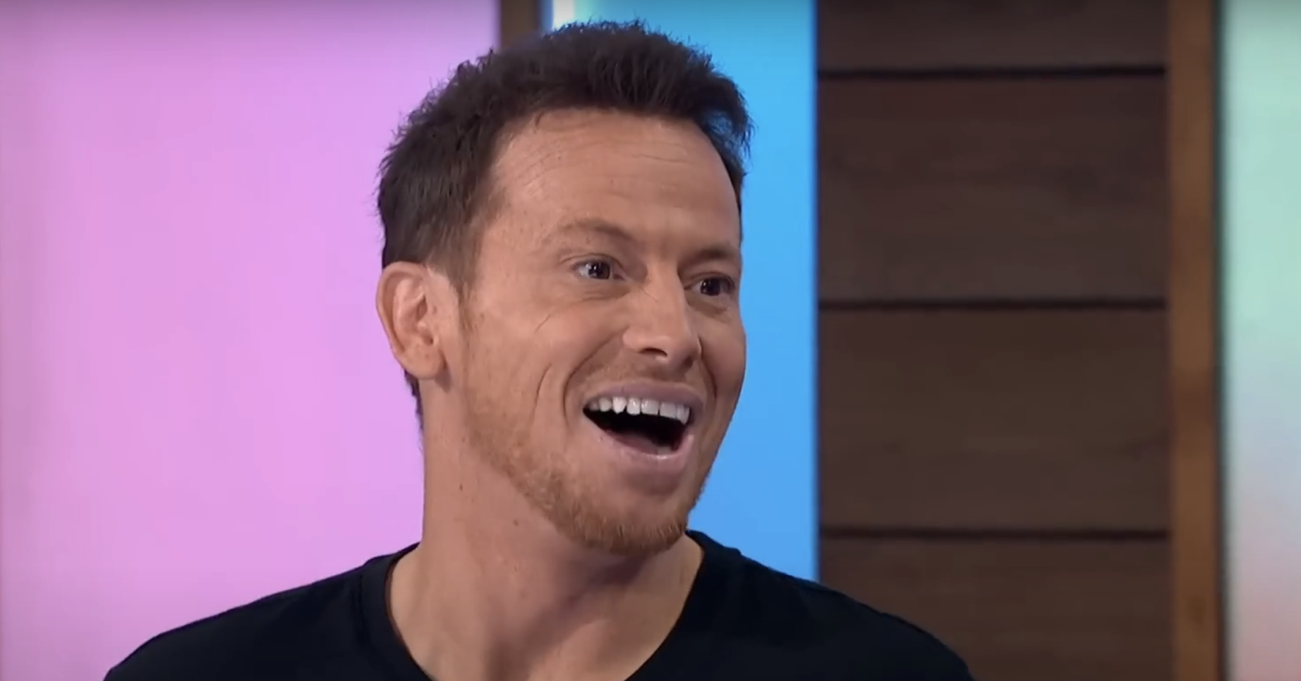 Joe Swash in a black T-shirt on Loose Women