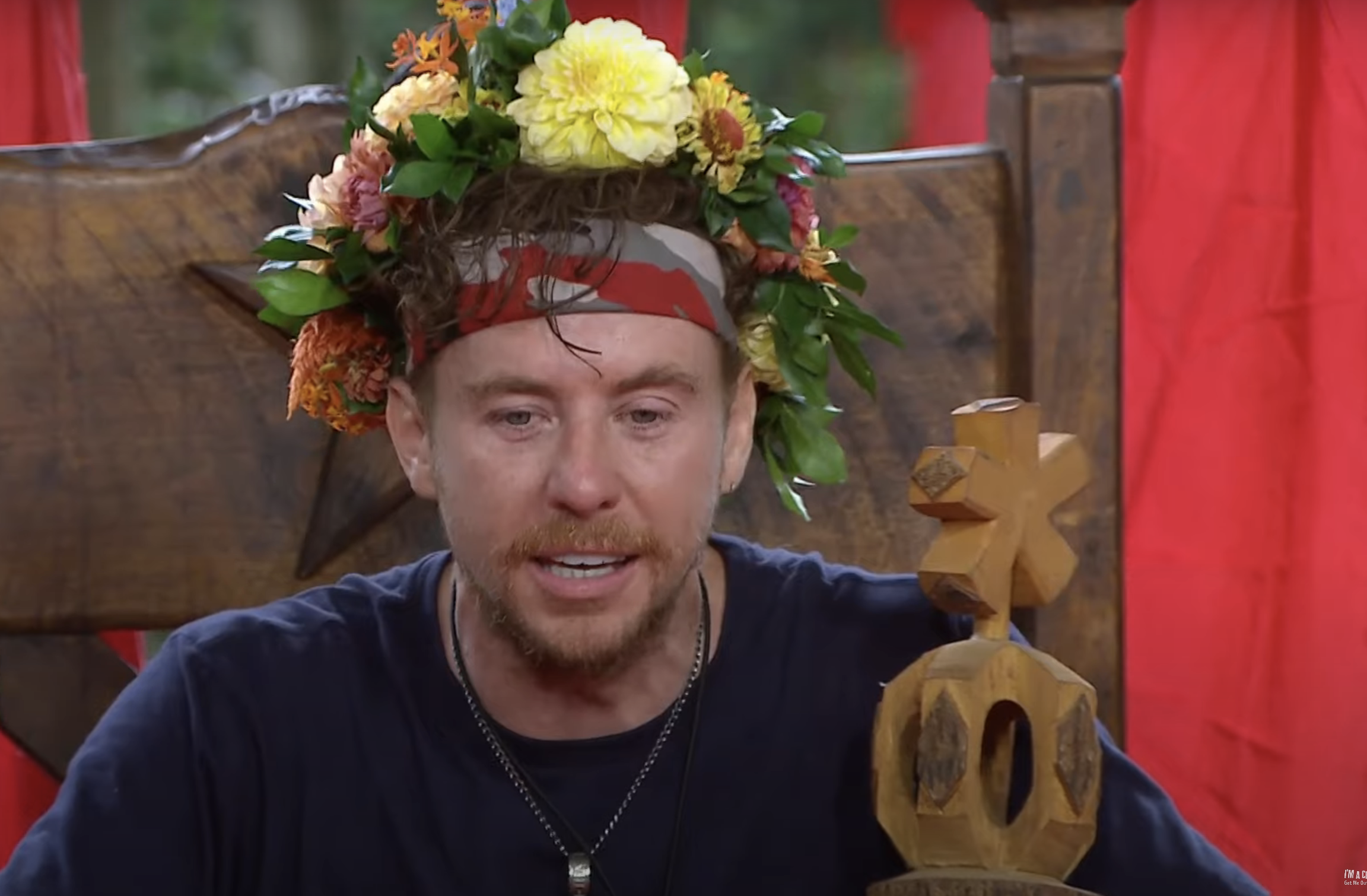 Danny Jones wields his sceptre and sits upon his throne during the I'm A Celebrity finale