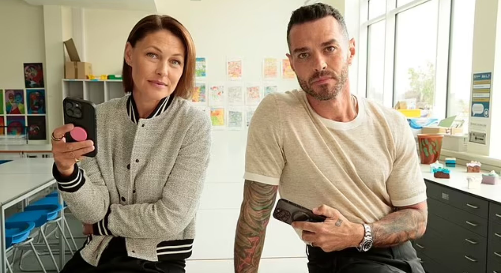 Matt and Emma Willis holding mobile phones