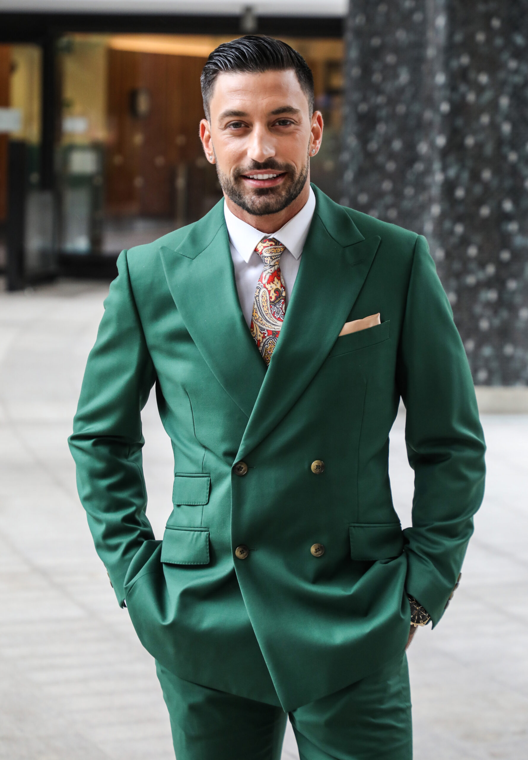 Giovanni Pernice poses for picture in a green suit at ITV Studios, London, UK - 23 Jun 2022