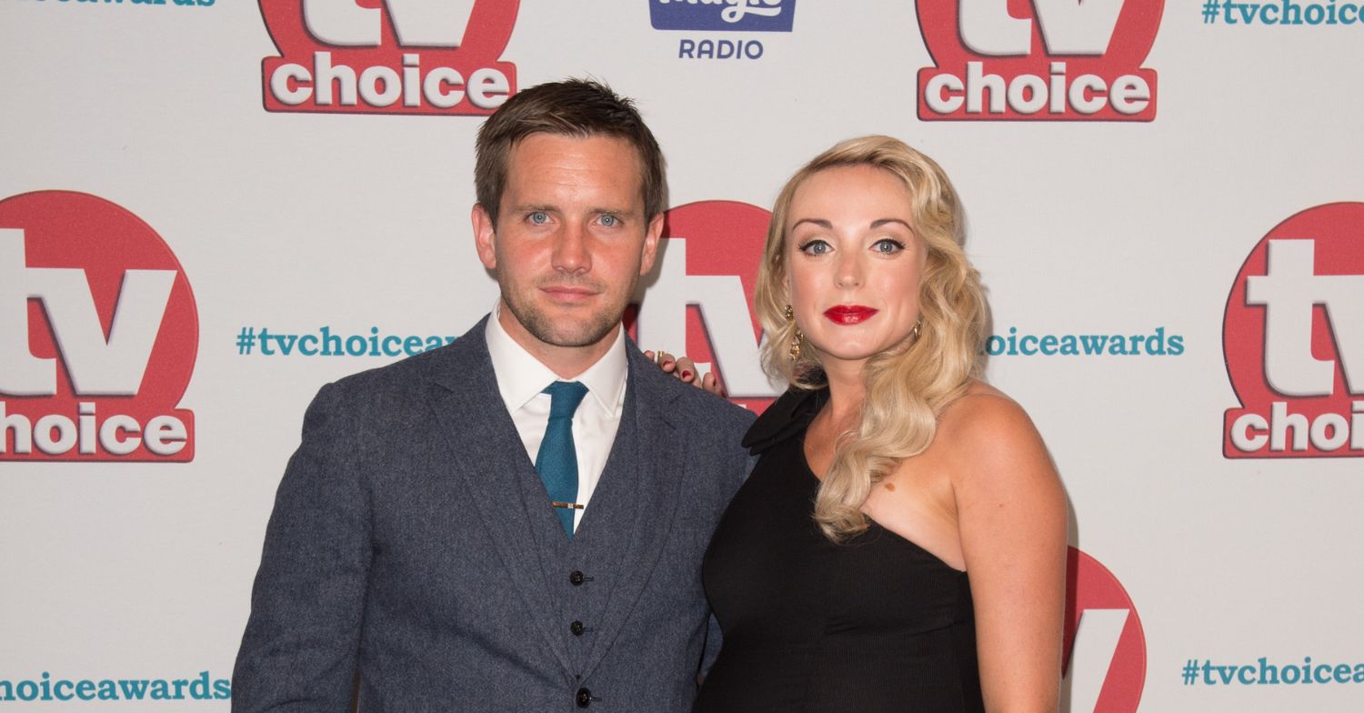 Jack Ashton and Helen George smiling at a red carpet event 