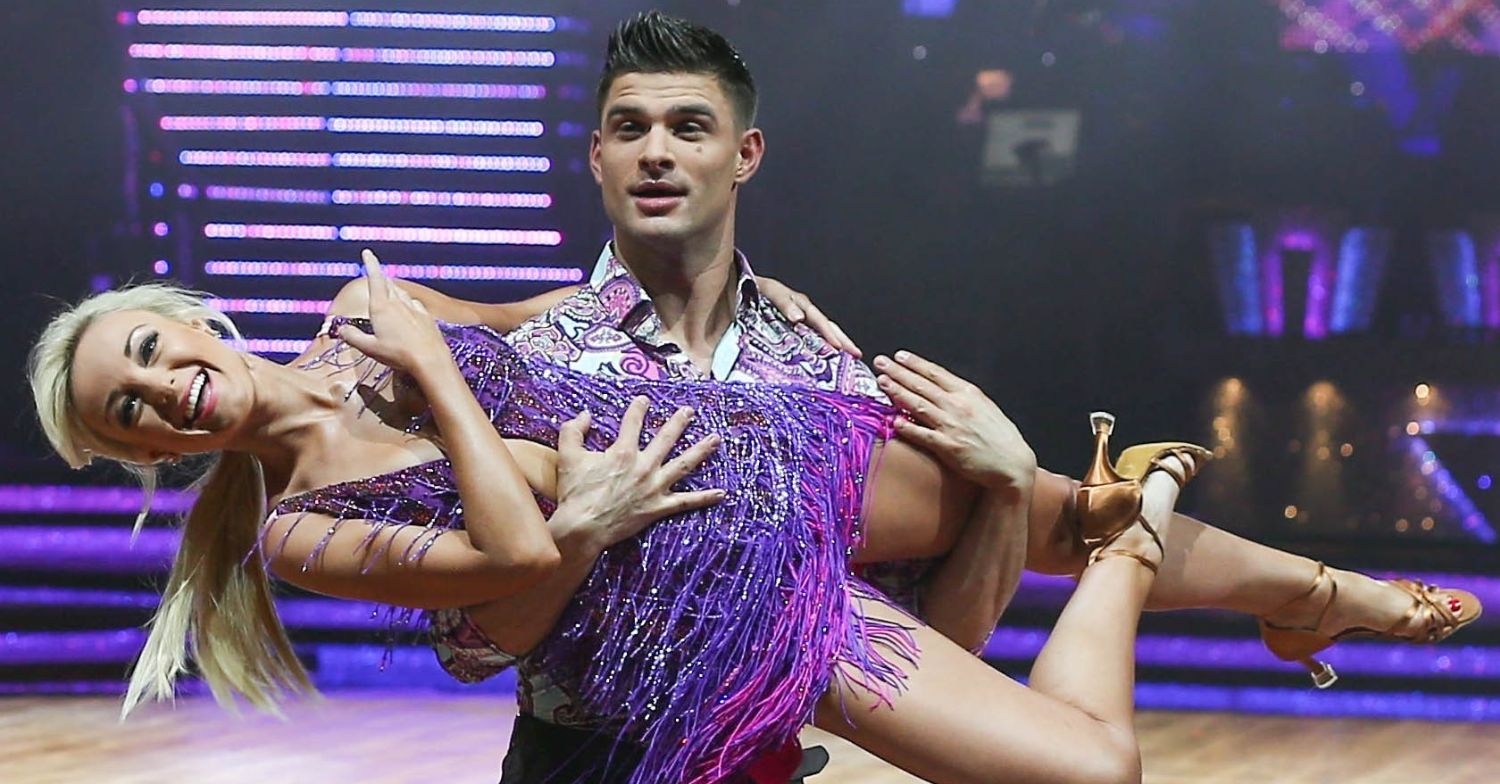 Aljaz Skorjanec picking Helen George up in a Strictly promo pic