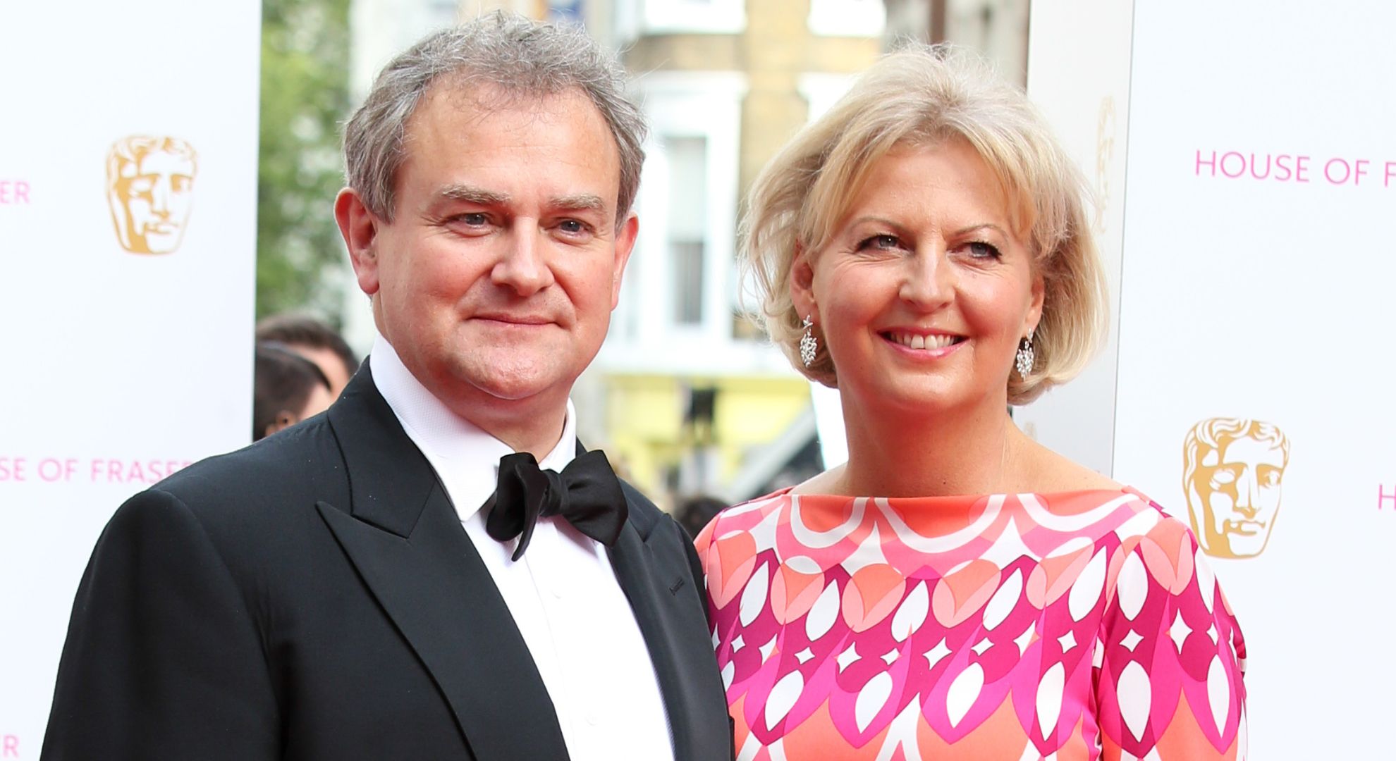 Hugh Bonneville and his wife smiling