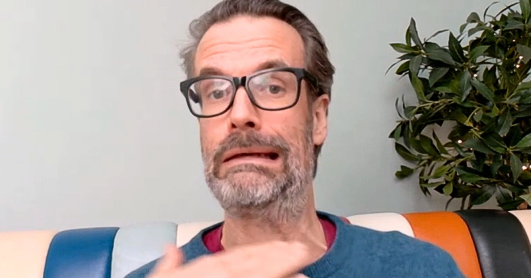 Marcus Brigstocke miming the fate of his character on Death In Paradise