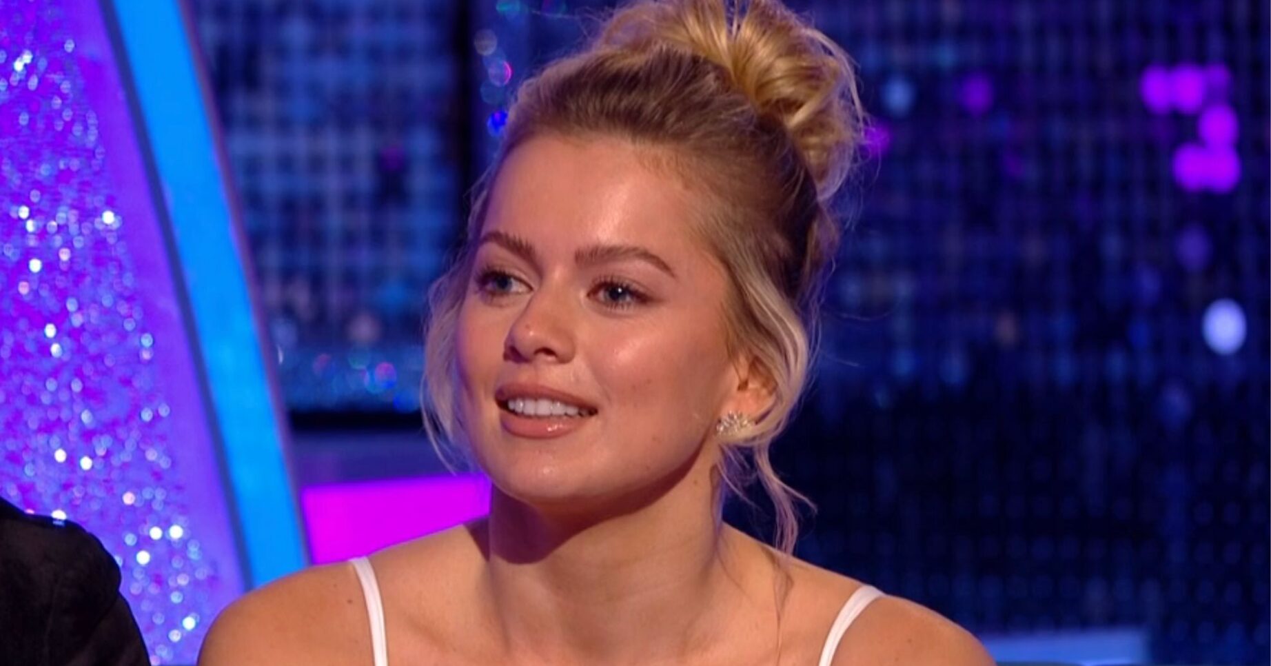 Tasha Ghouri smiling slightly on It Takes Two