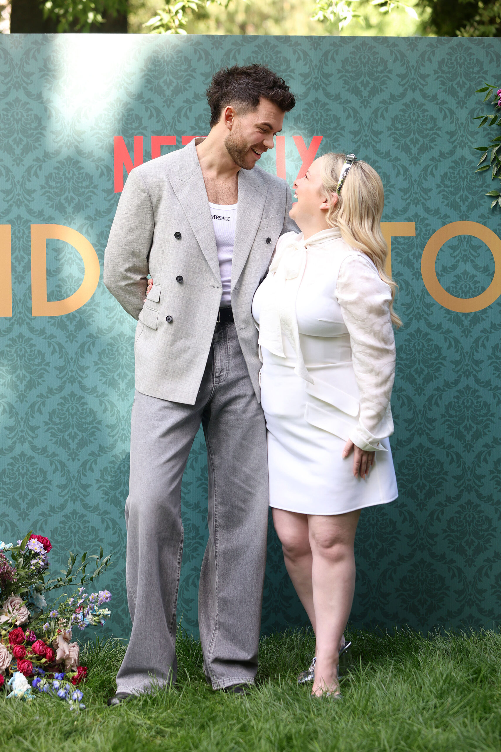 Nicola Coughlan and Luke Newton looking at each other