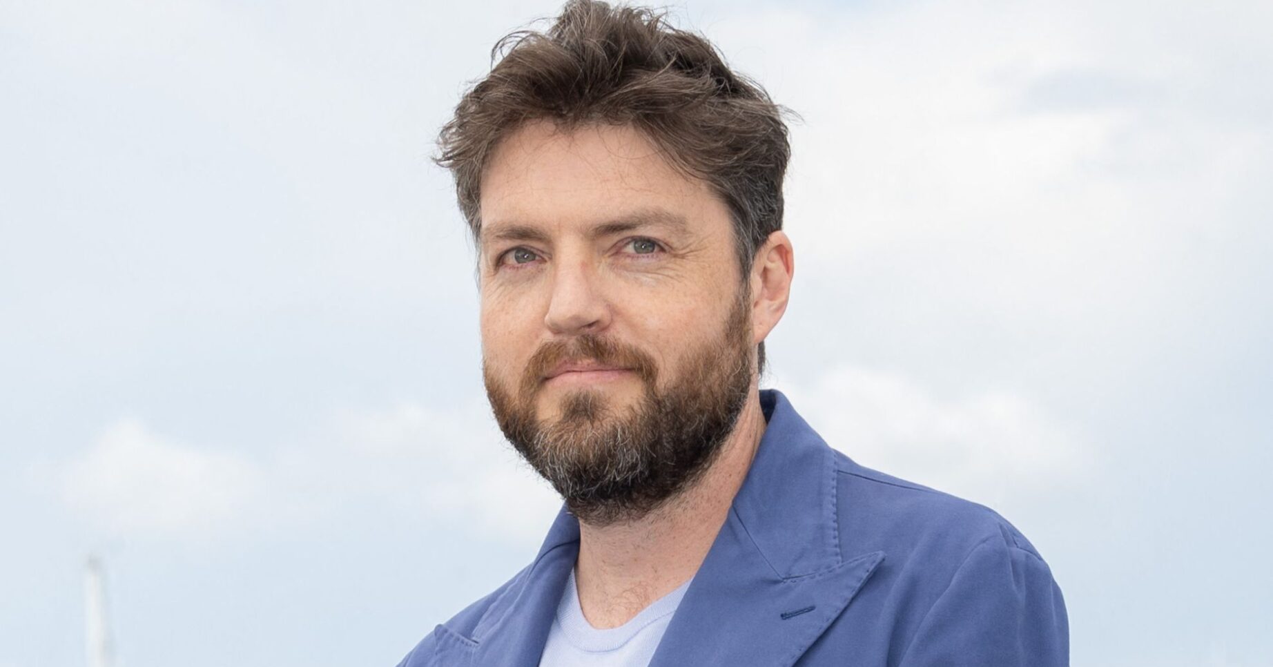 Tom Burke smiling