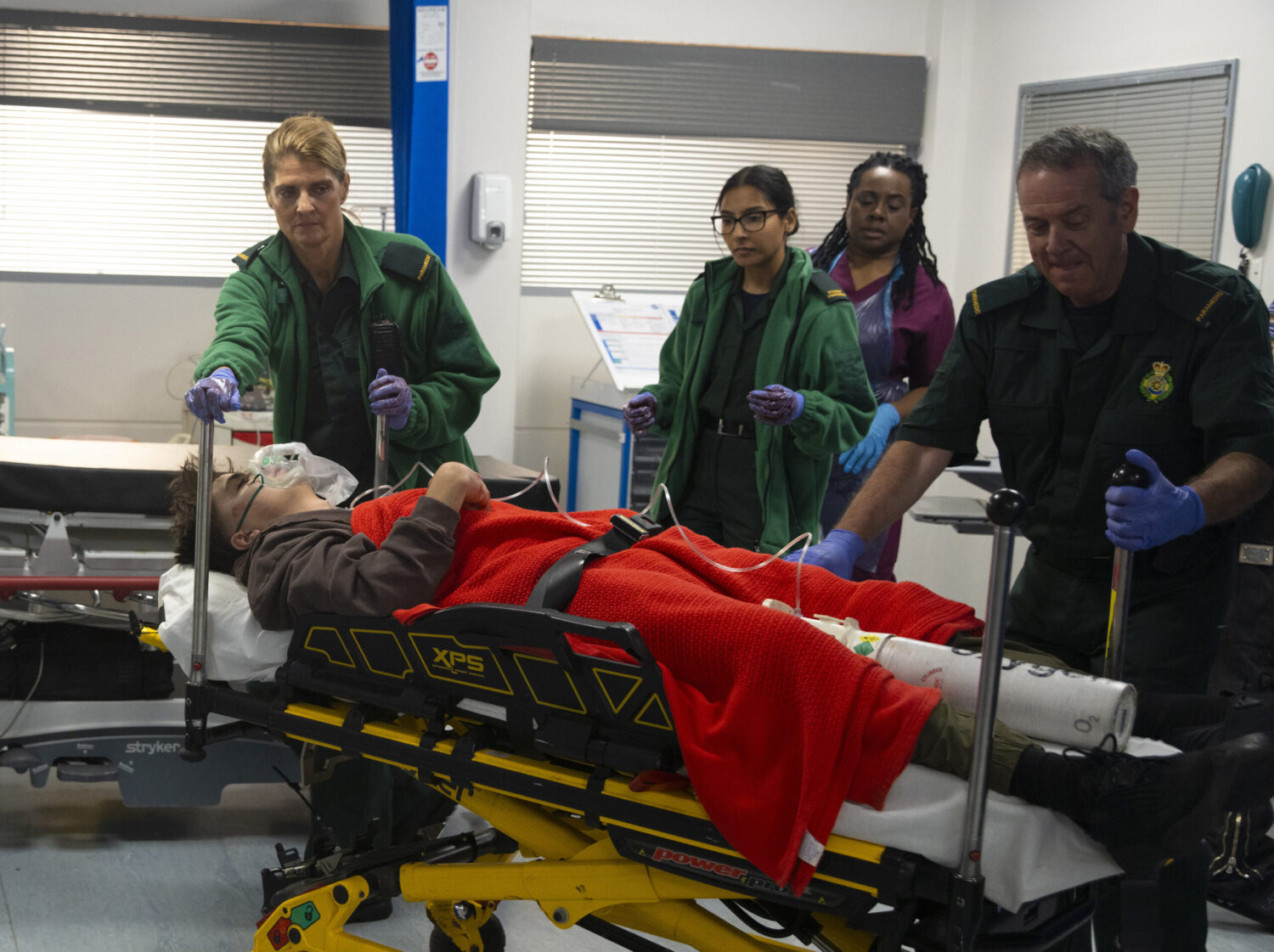 Mason on a stretcher in hospital