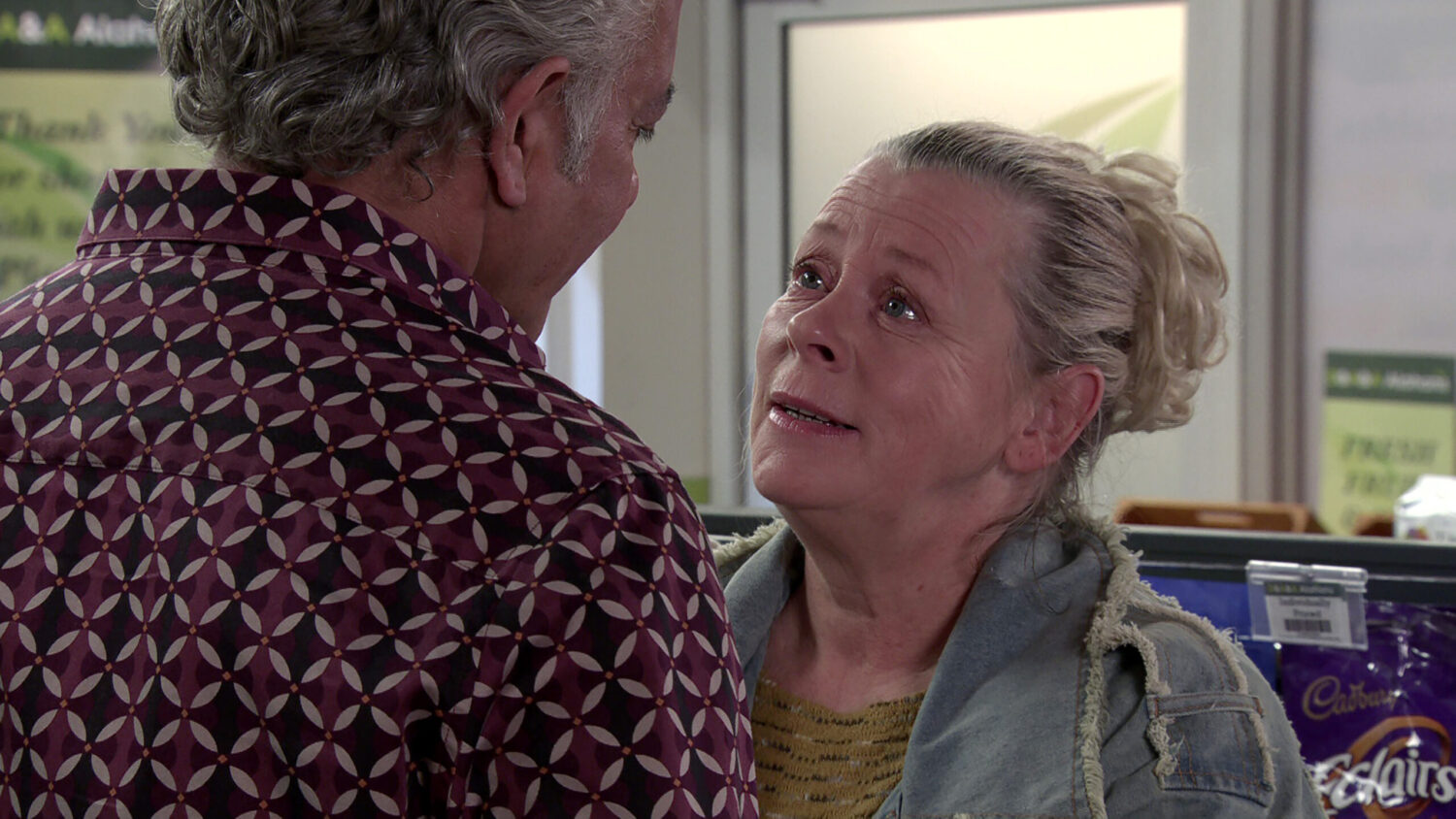 Bernie talking to Dev in the shop on Corrie