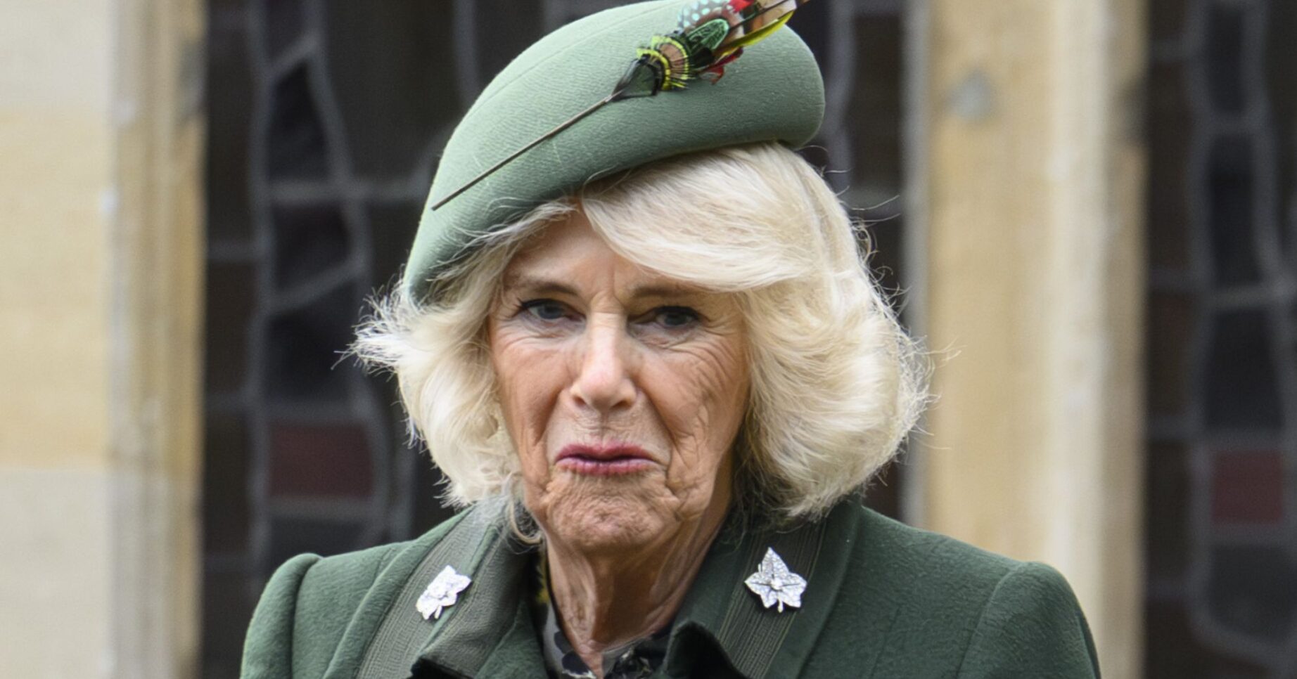 Queen Camilla in all green outfit leaving church service on Christmas Day
