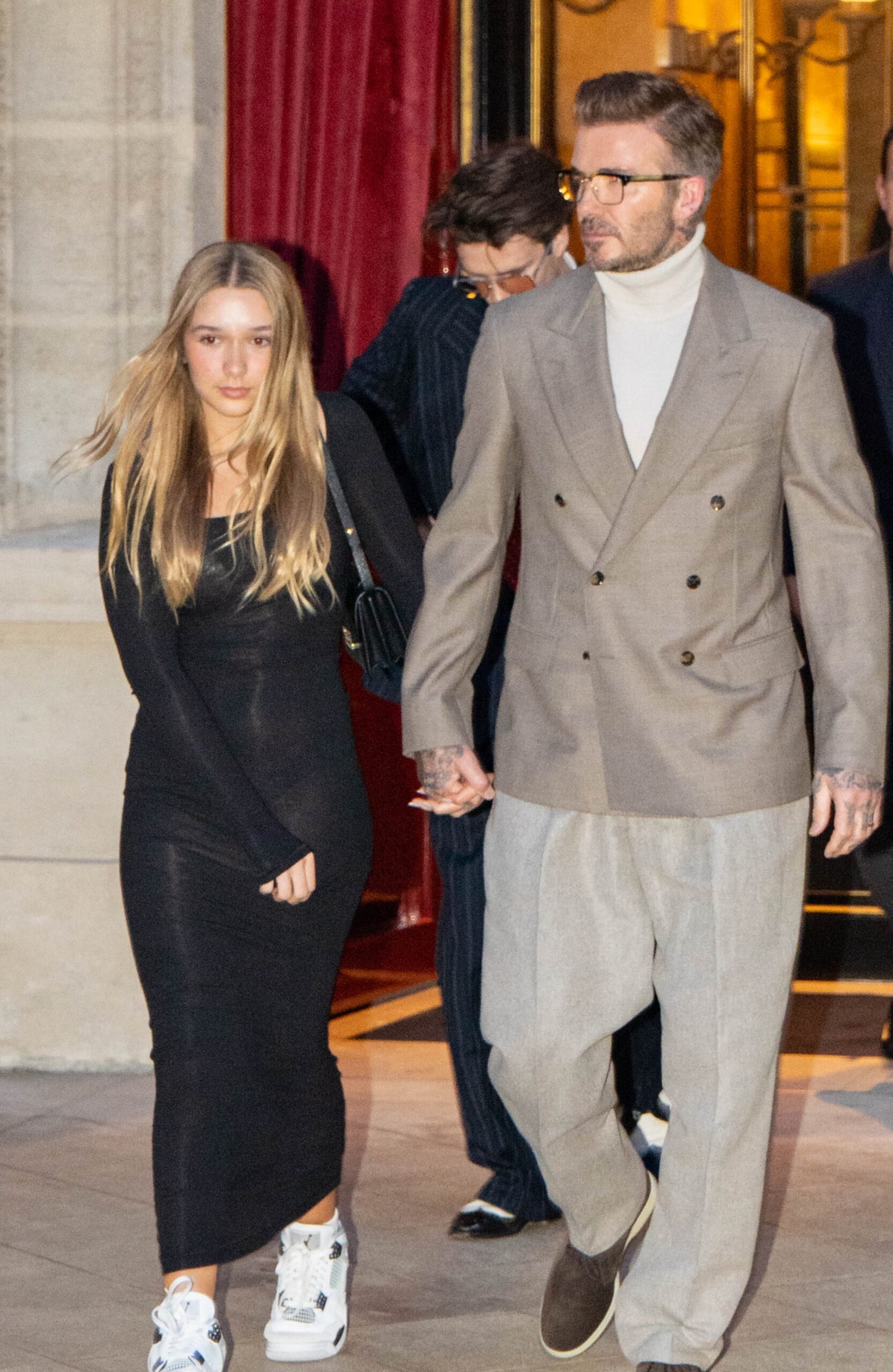 Harper Beckham walking whilst holding hands with David Beckham