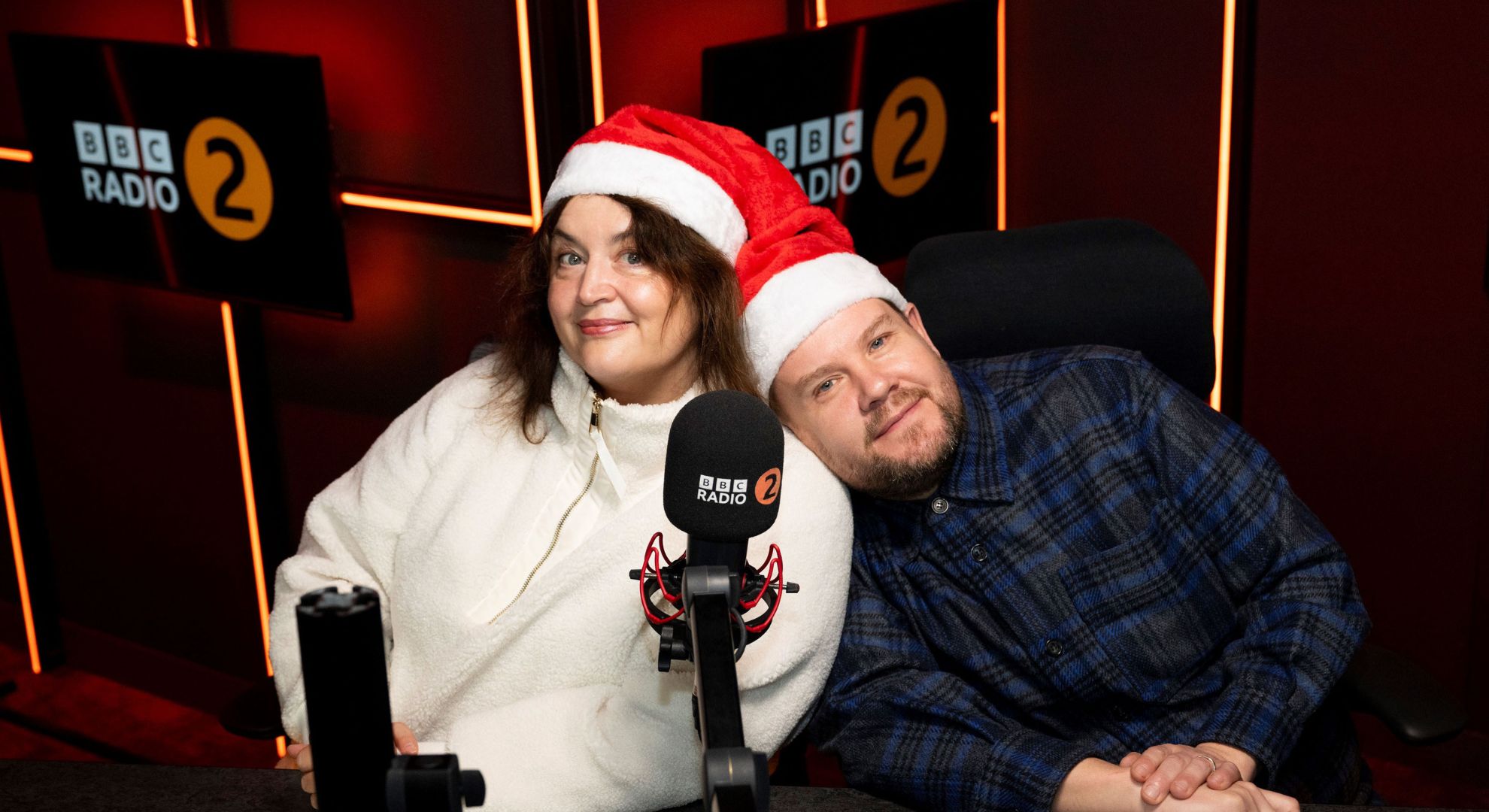 James Corden and Ruth Jones smiling on the radio