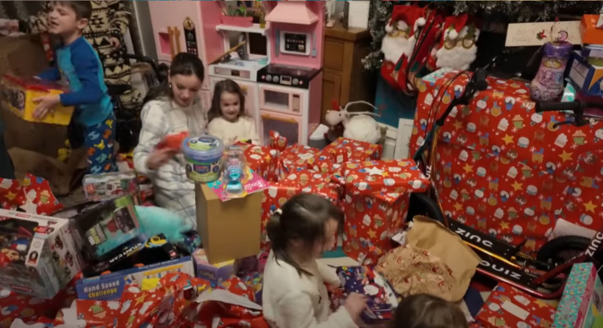 The Radford family children opening presents on Christmas morning