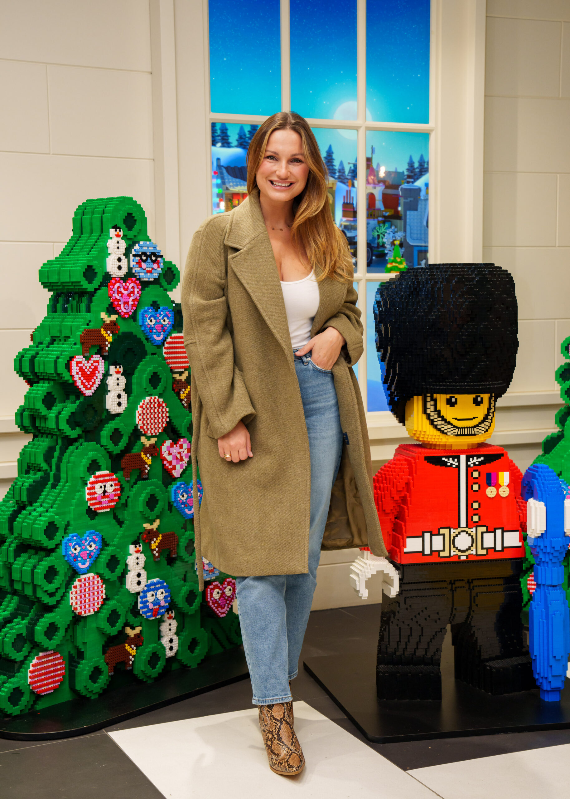 Sam Faiers standing next to some Lego models