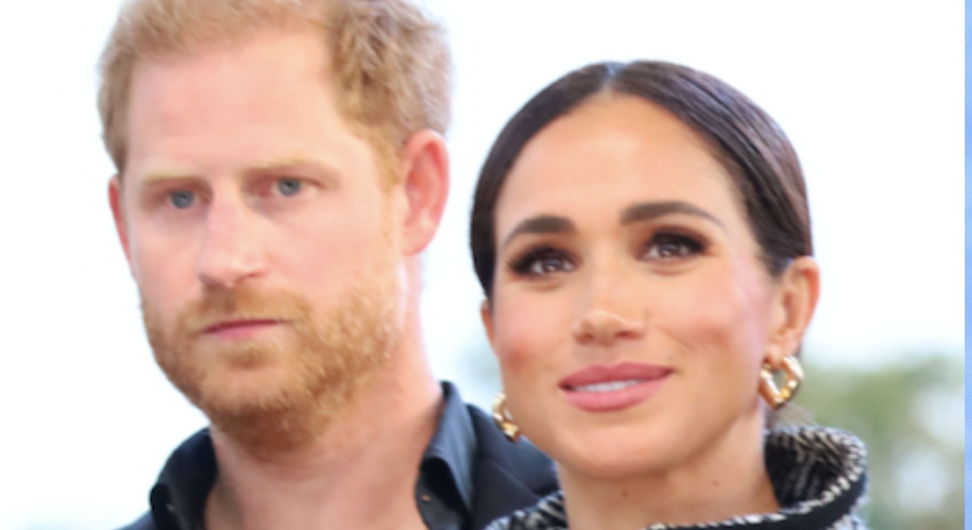 Prince Harry and Meghan markle looking serious