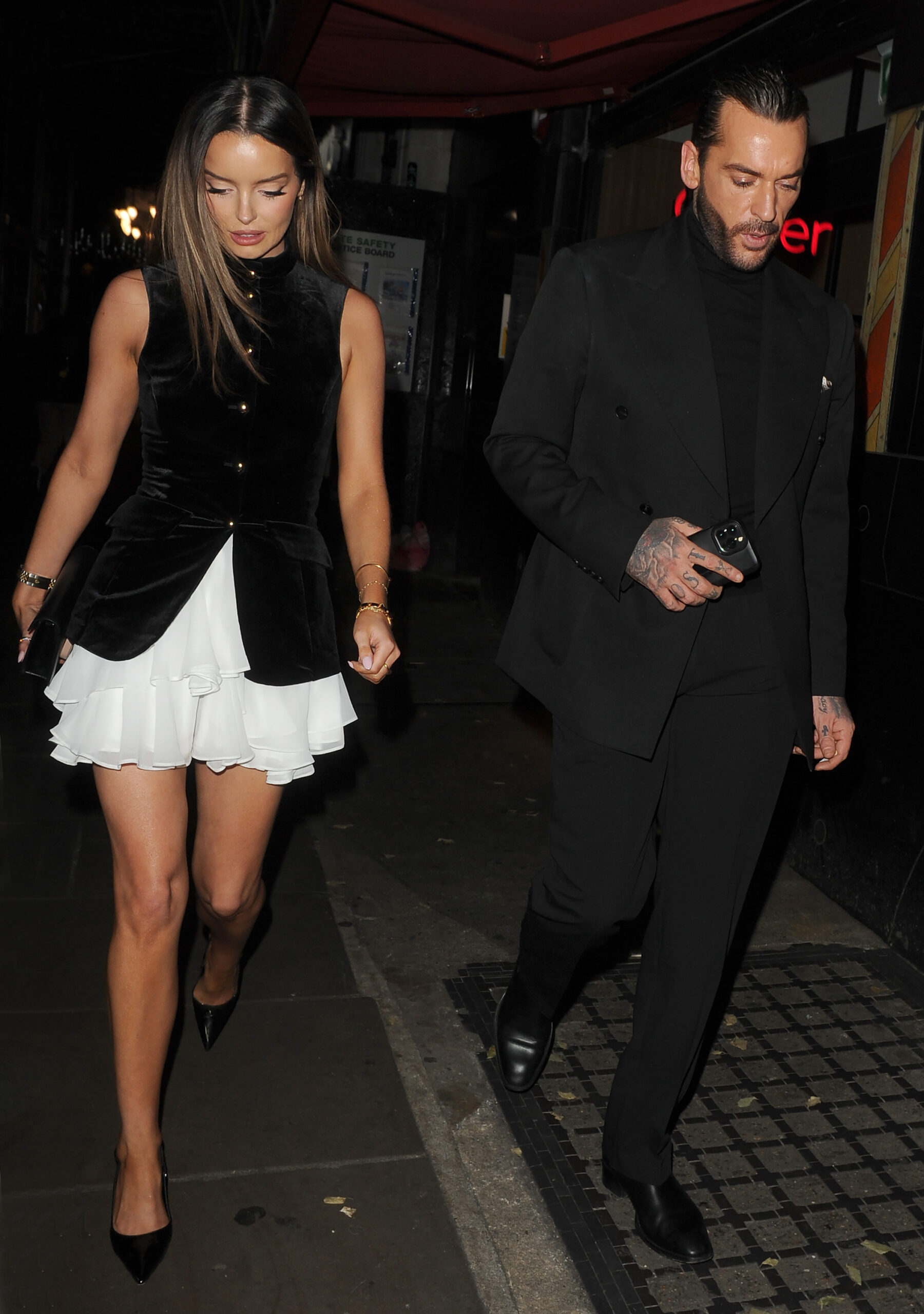 Maura Higgins and Pete Wicks waking side by side on a rare date night, at the London Palladium