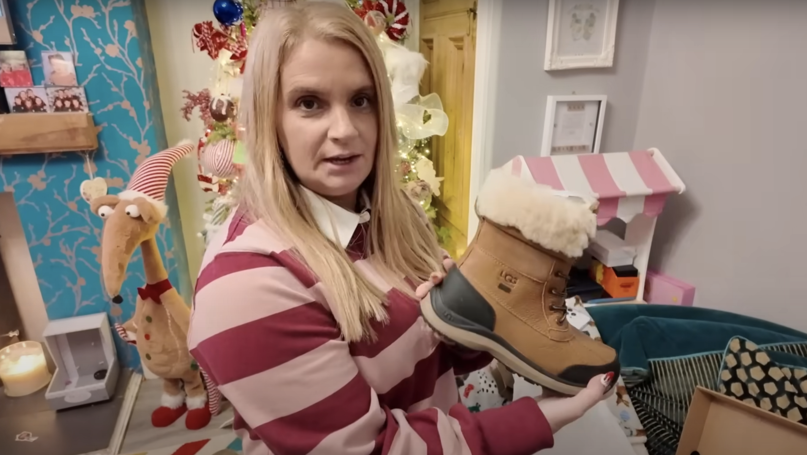 Sue Radford unboxing a pair of boots