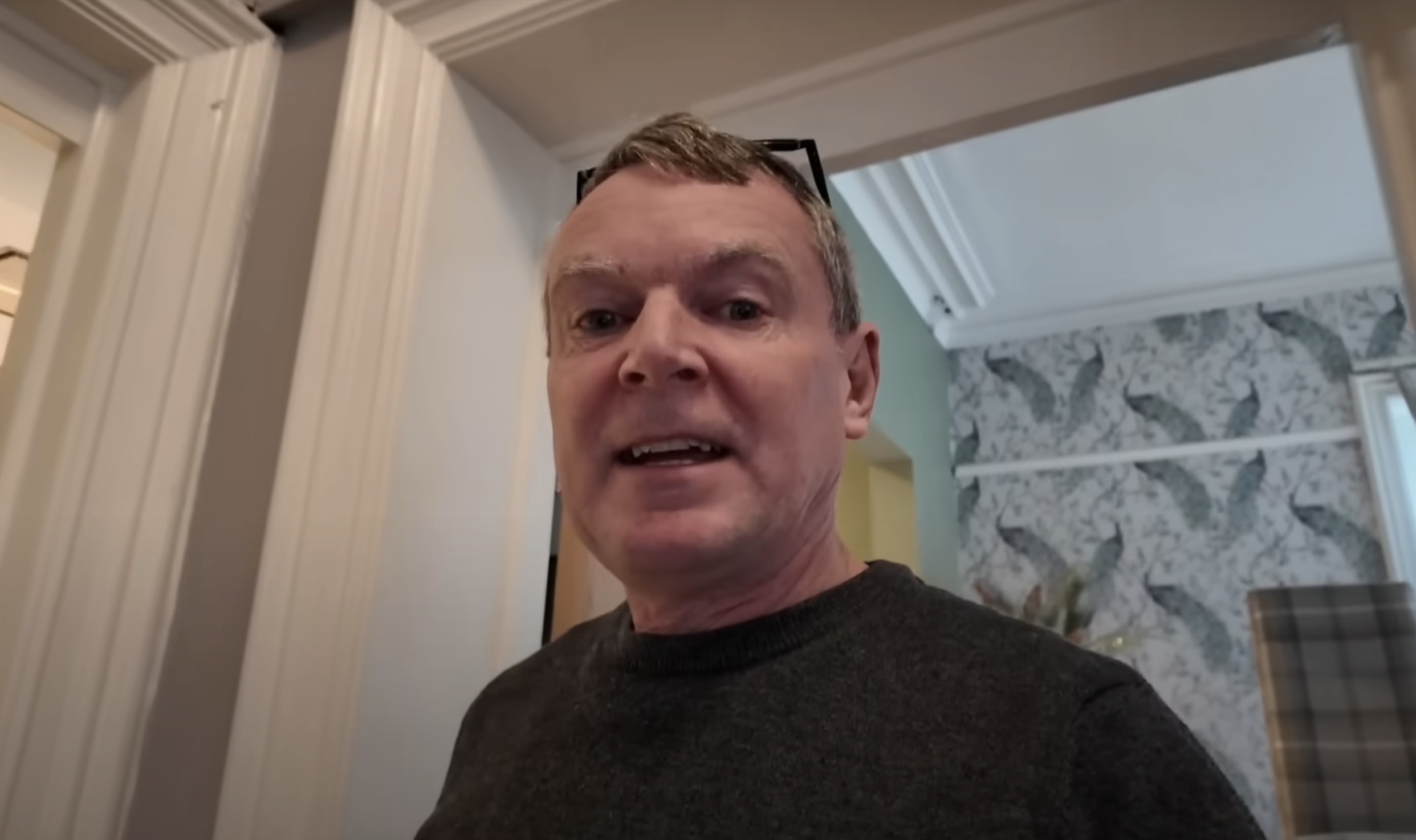 Noel Radford shooting a vlog in the Radford family home