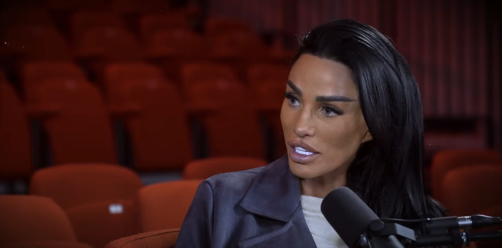 Katie Price wears a white t-shirt and black leather jacket