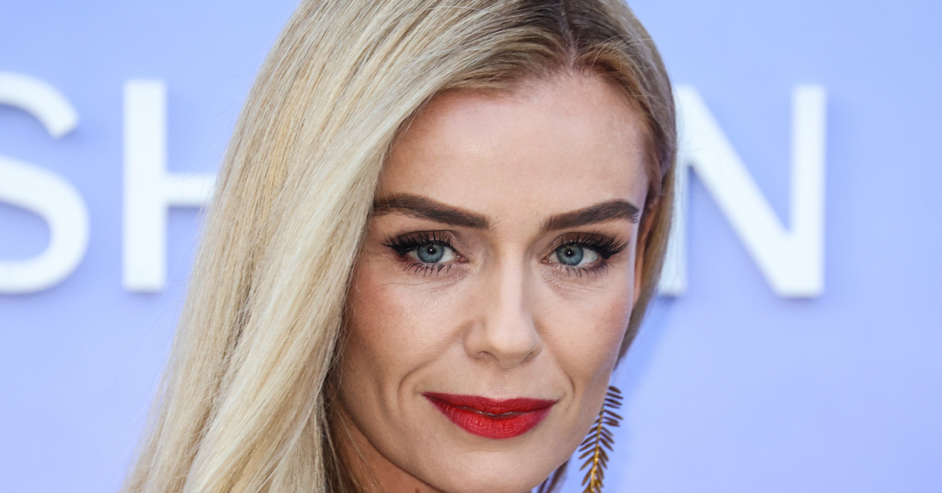 Katherine Jenkins smiling in a floral dress