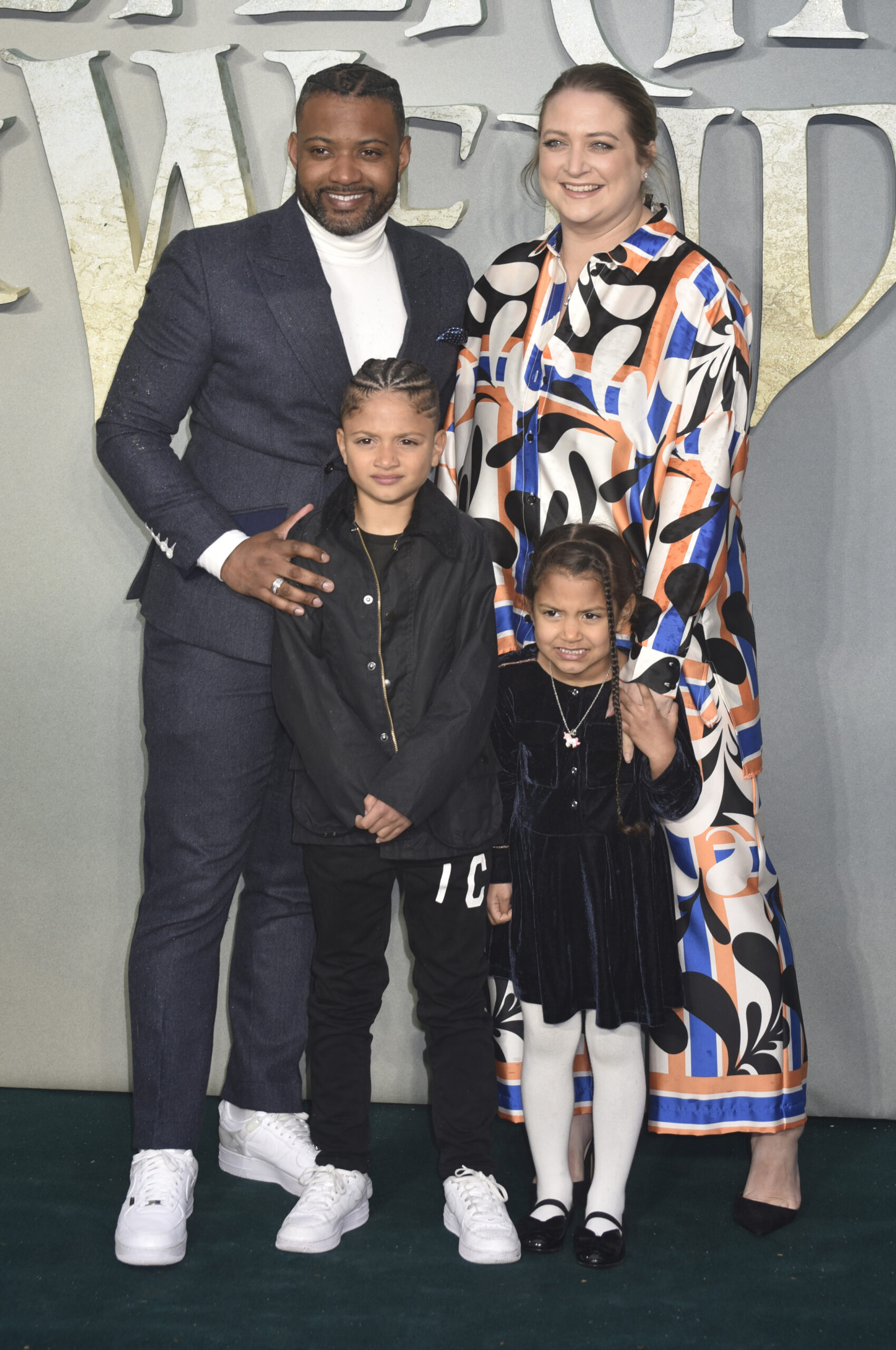 JB and Chloe Gill with their children on the red carpet